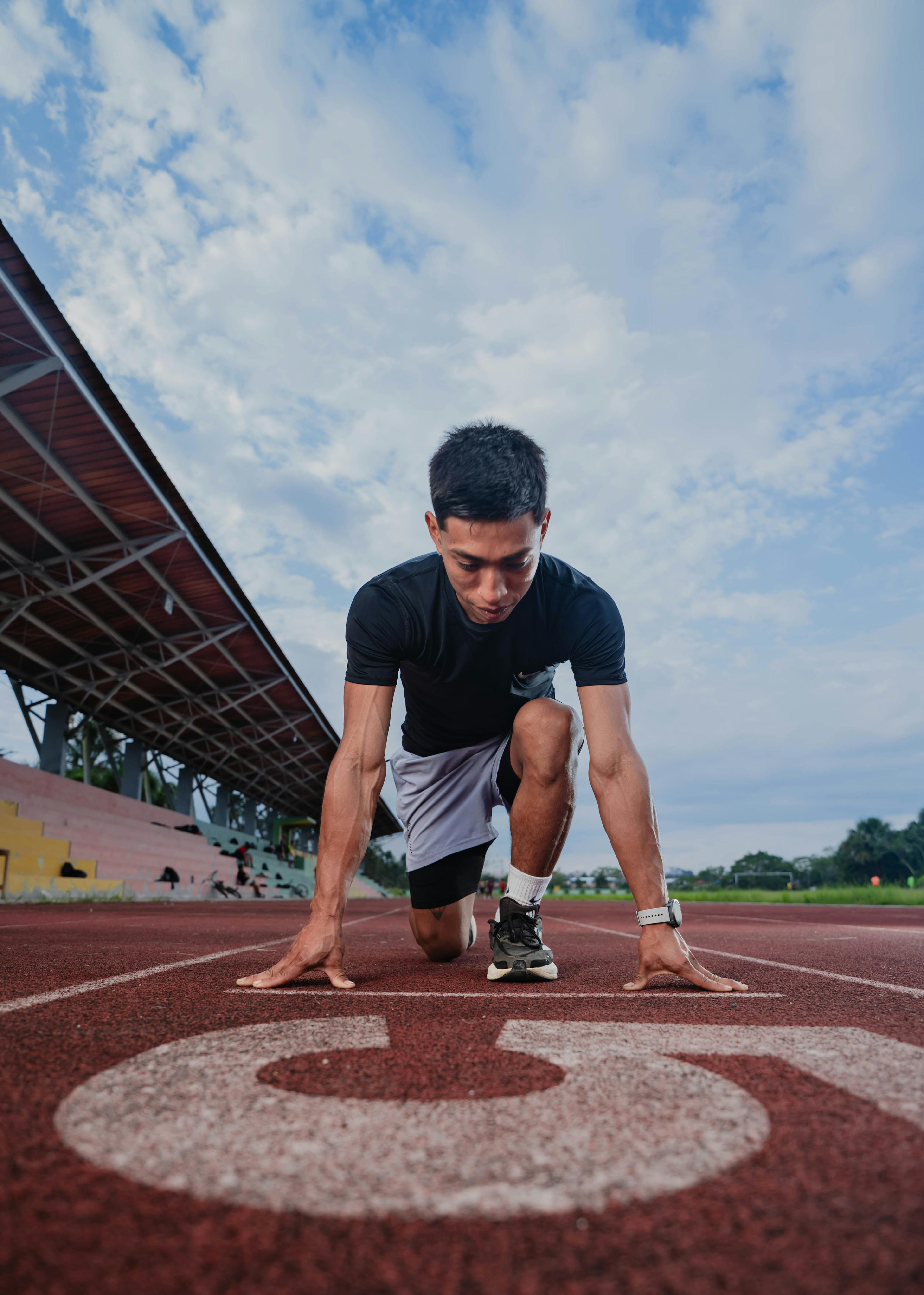 Man ready to sprint on a track