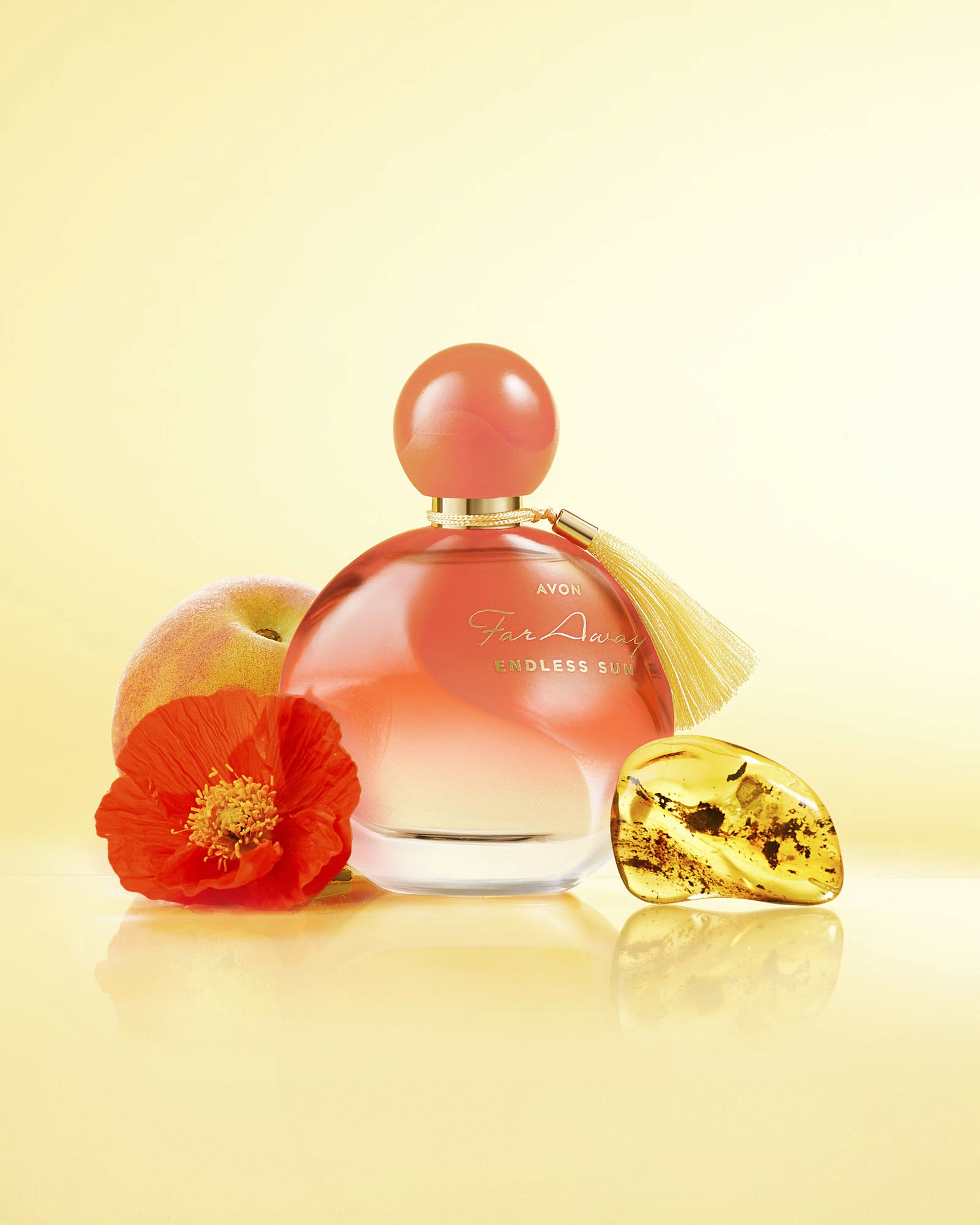A pink perfume bottle surrounded by orange and yellow decorative elements against a light yellow background.