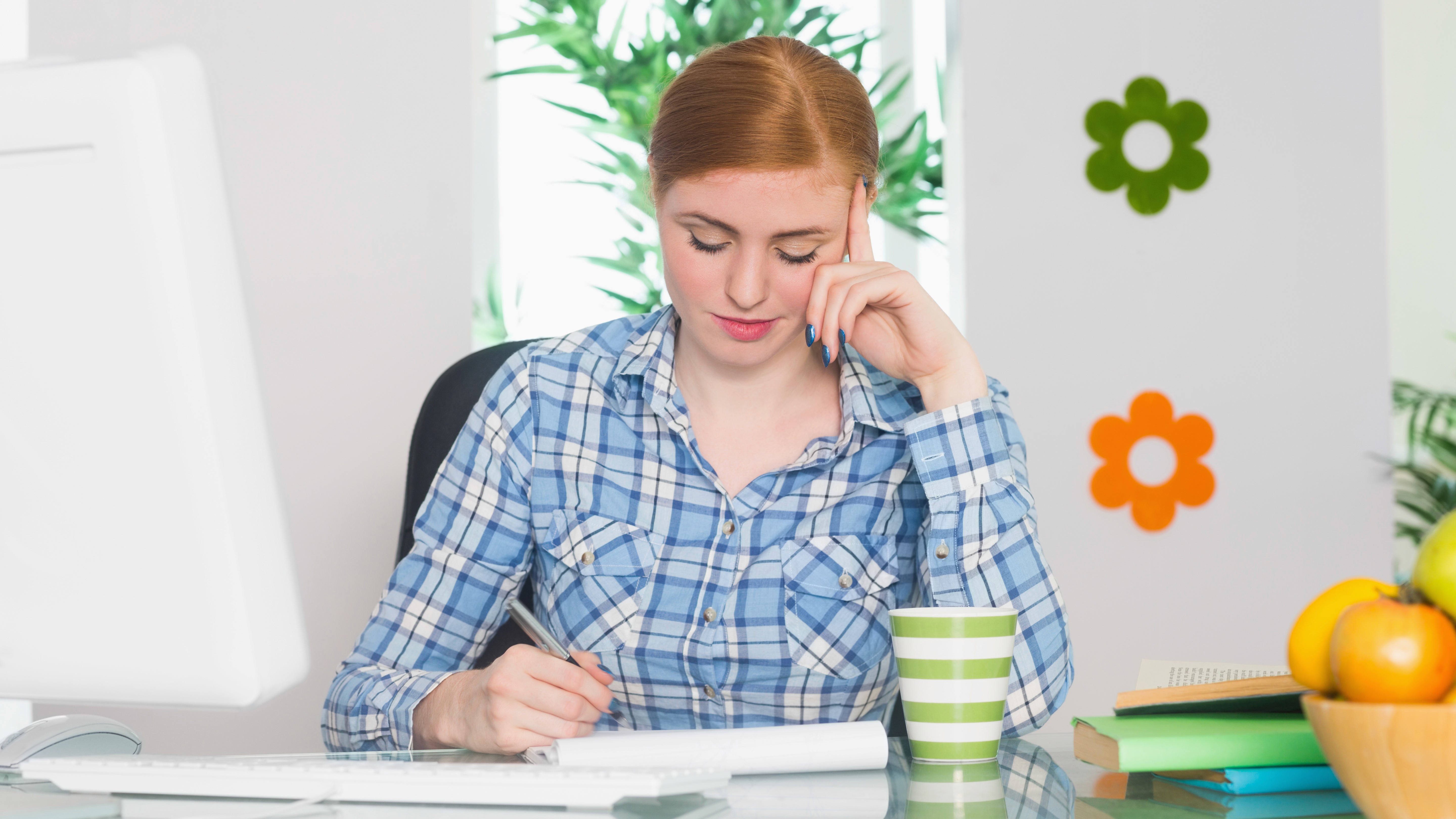 A pretty woman working and thinking about balancing healthy lifestye