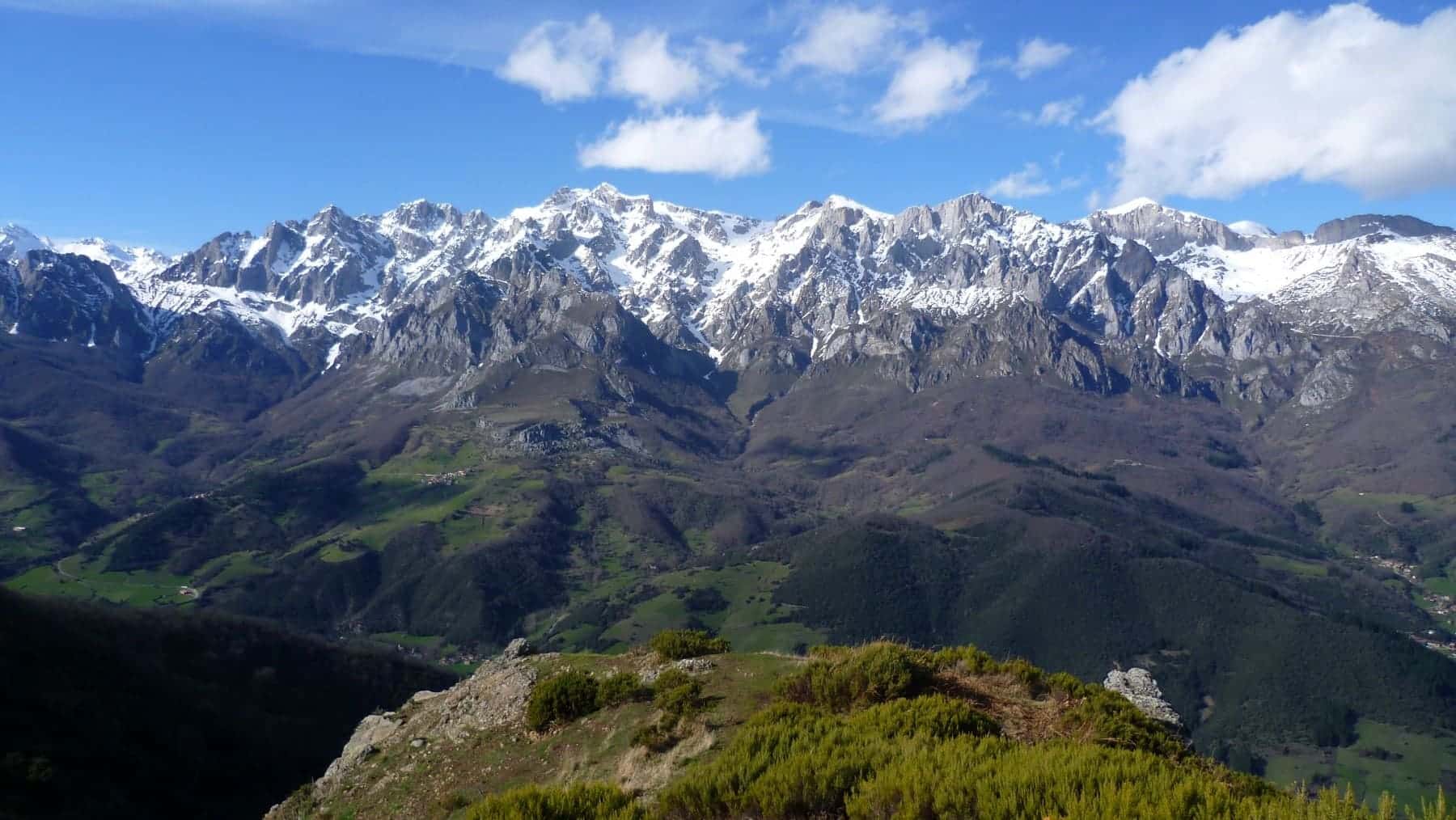 Scenic view of mountains with snow-capped peaks.