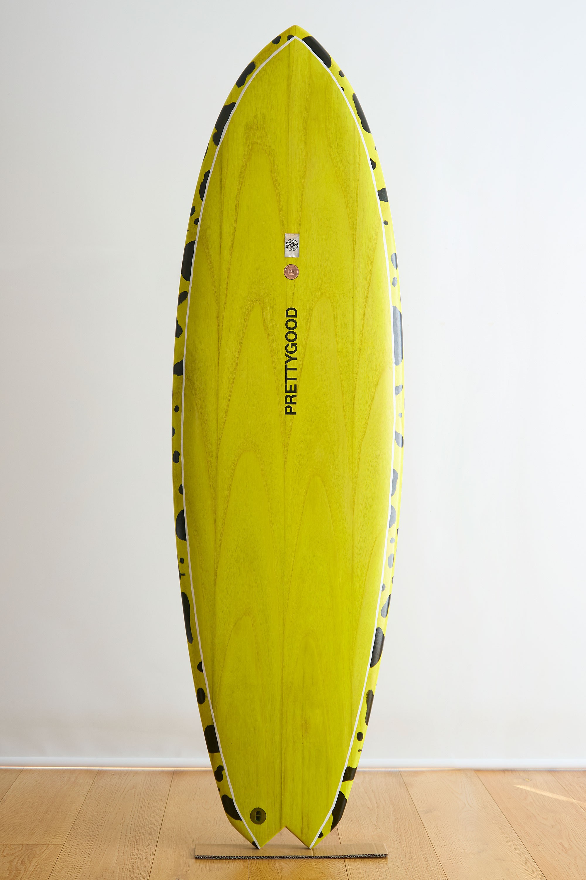 Yellow painted wooden surfboard