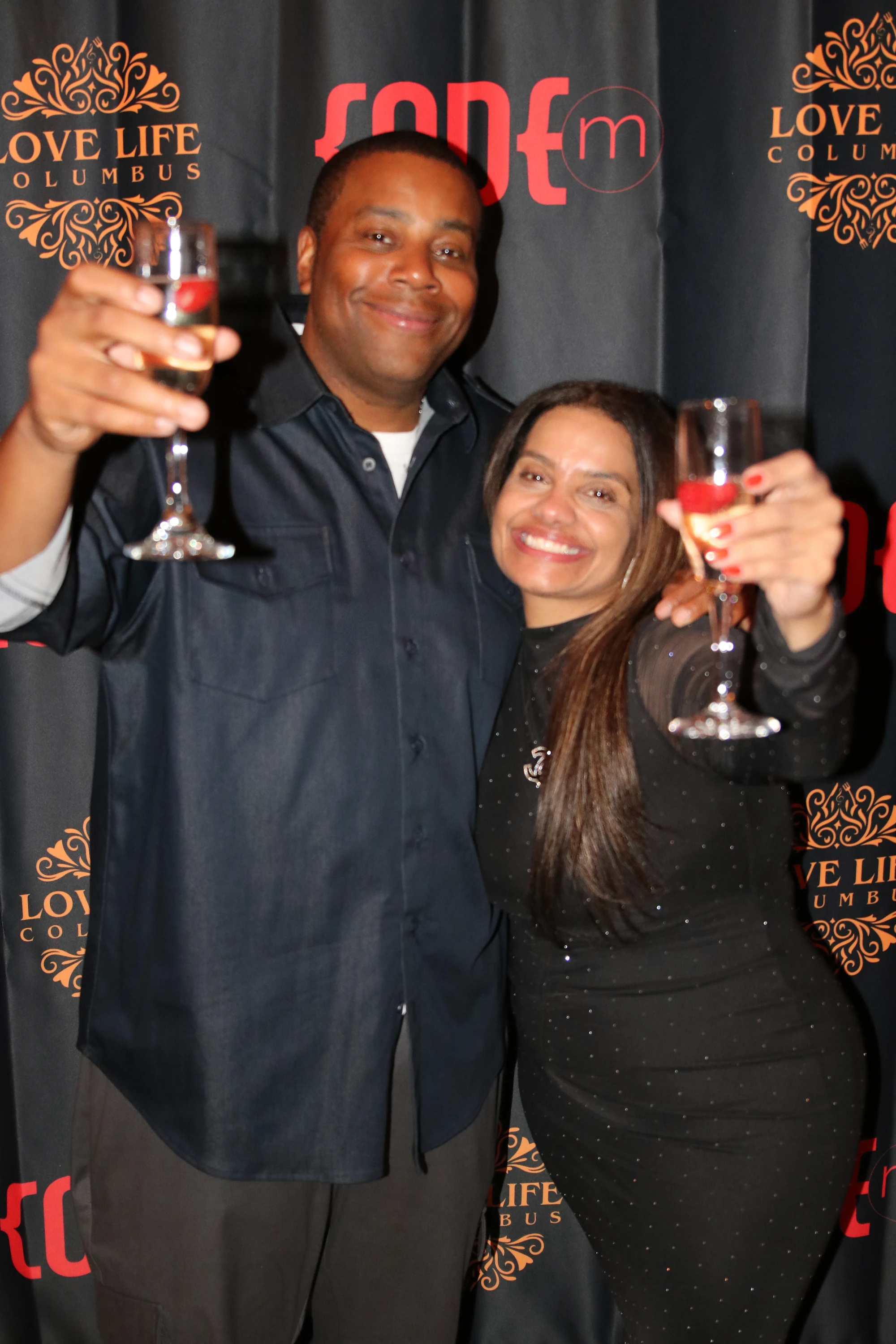 Bartender pouring champagne into a glass, golden liquid catching the backlight