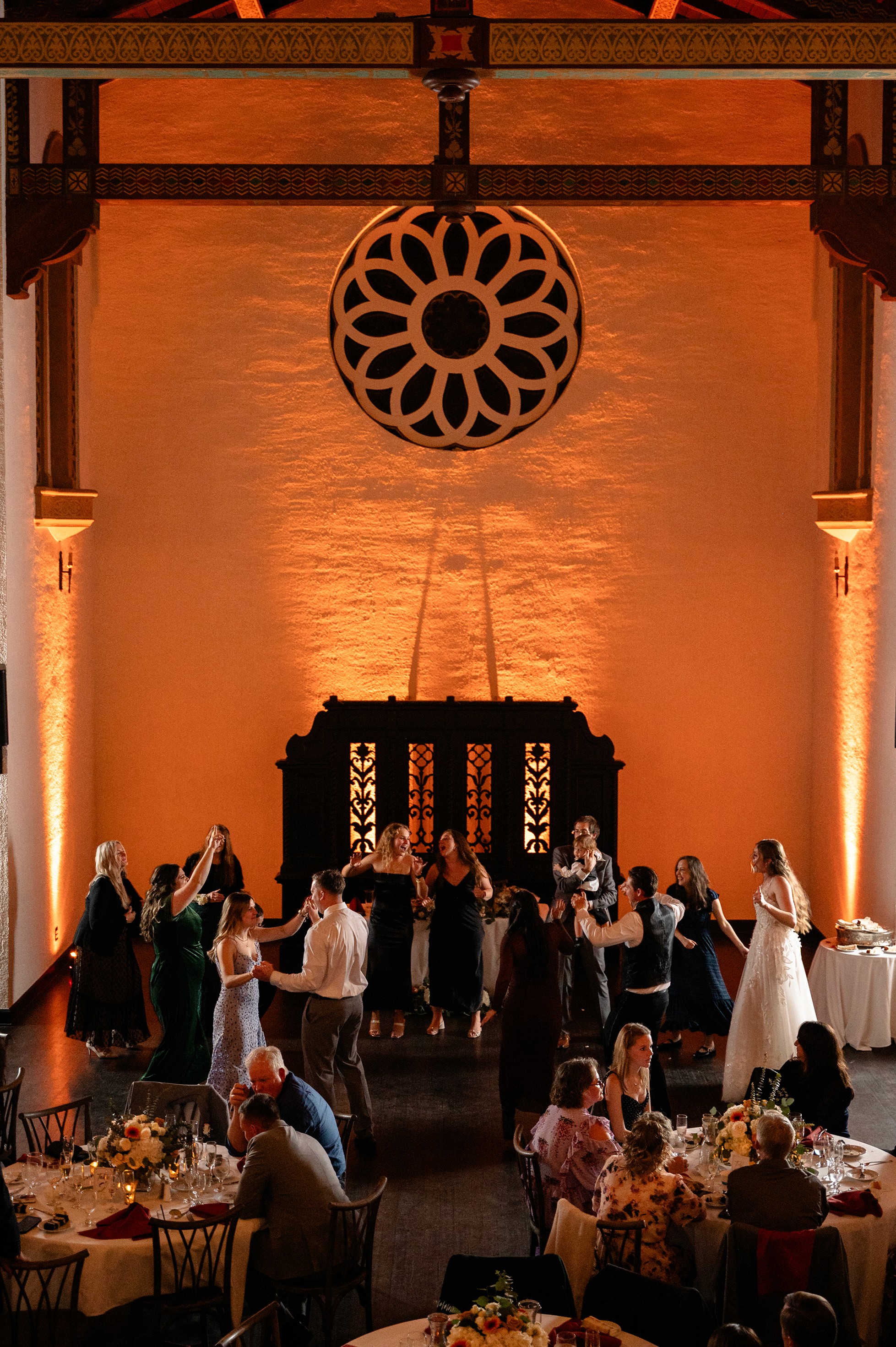 Flat lay wedding details with bouquet, rings, and sparkling bridal heels