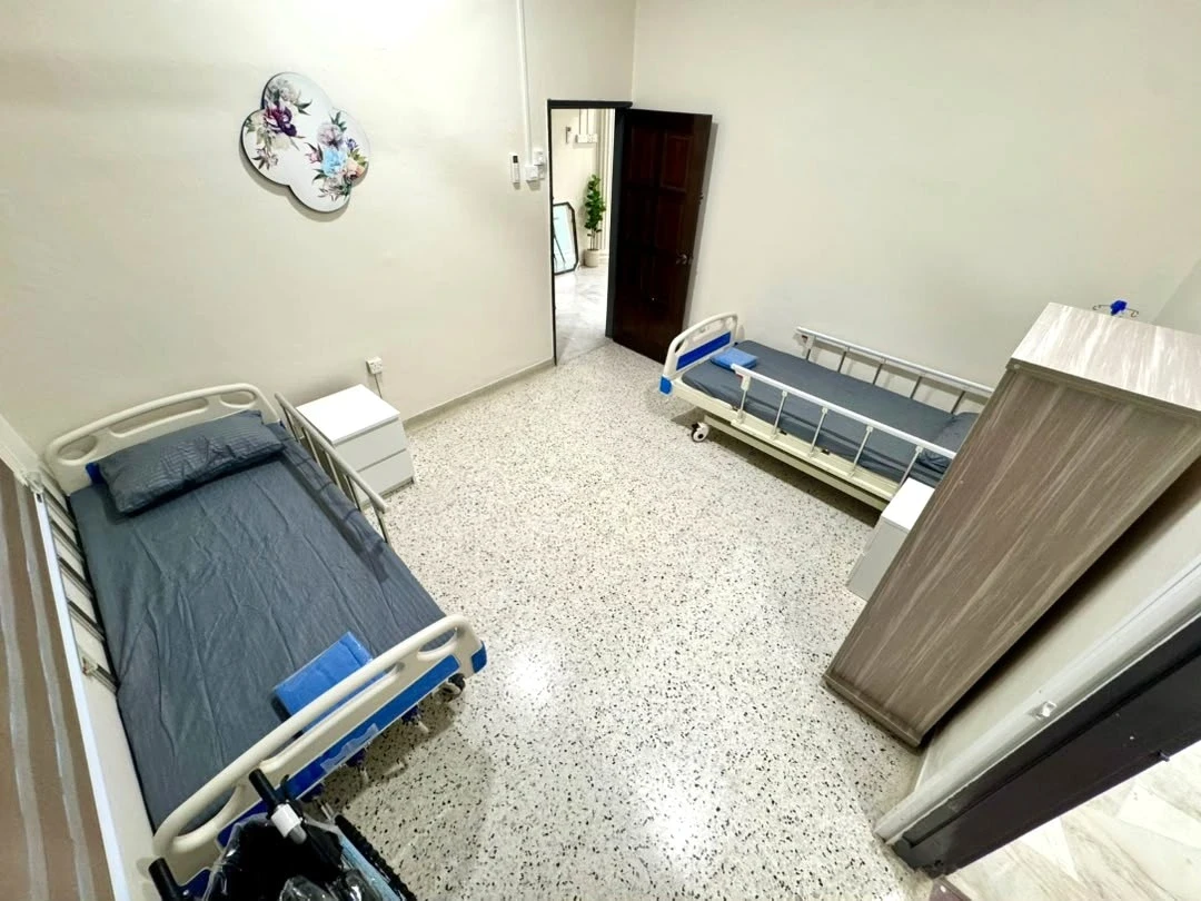 2-bedded room with safe and adjustable beds for senior residents at Golden Oaks Jalan Gasing branch.