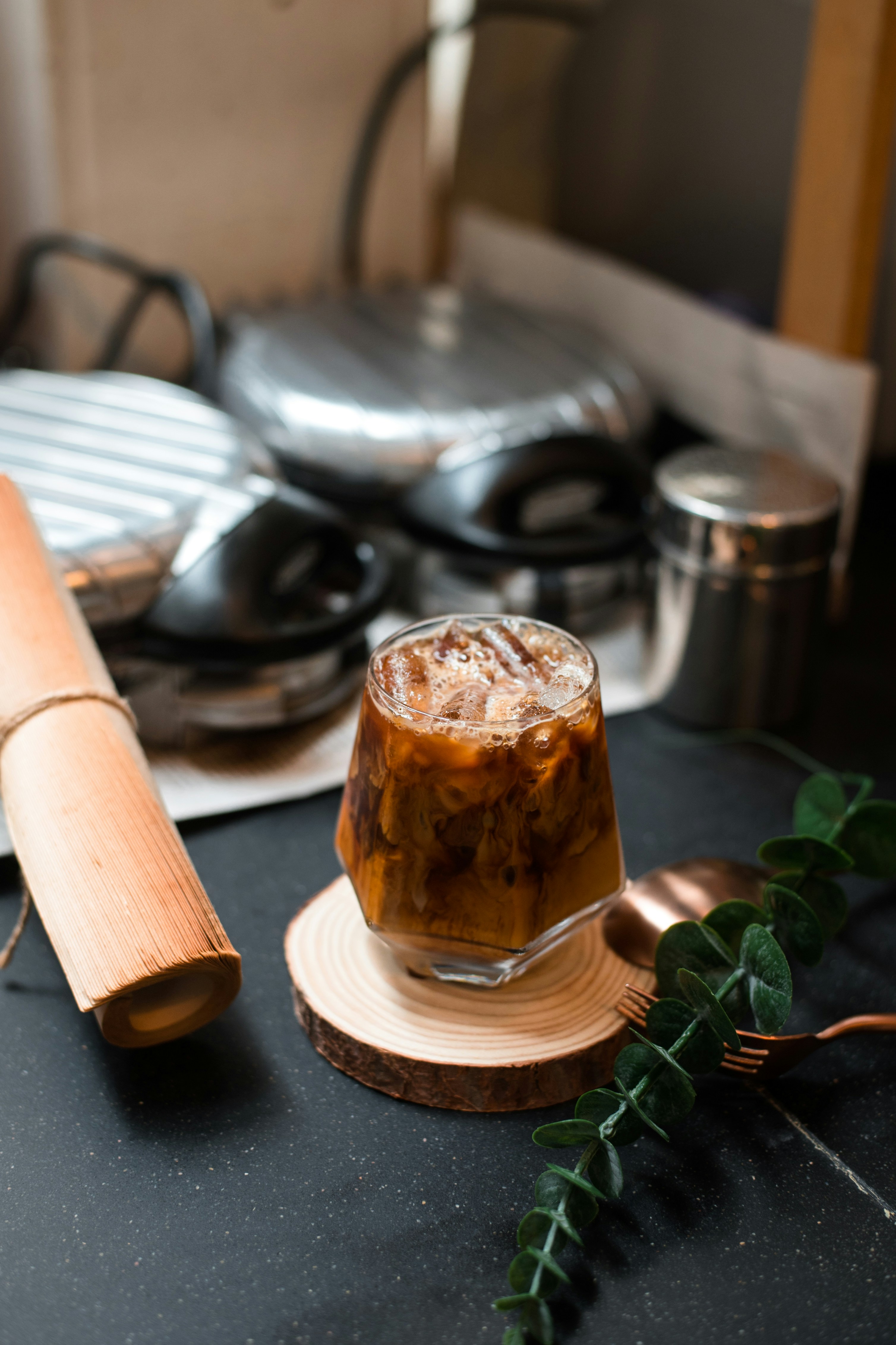 a glass of iced tea sitting on top of a table
