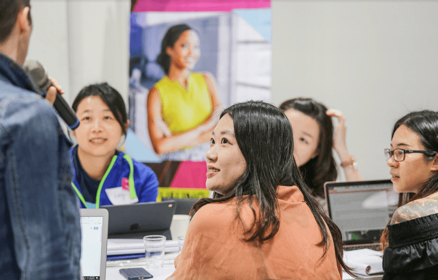 Physician speaking with a patient, representing the in-depth interviews and dyads Public Works uses to understand lived experience and inform human-centered design
