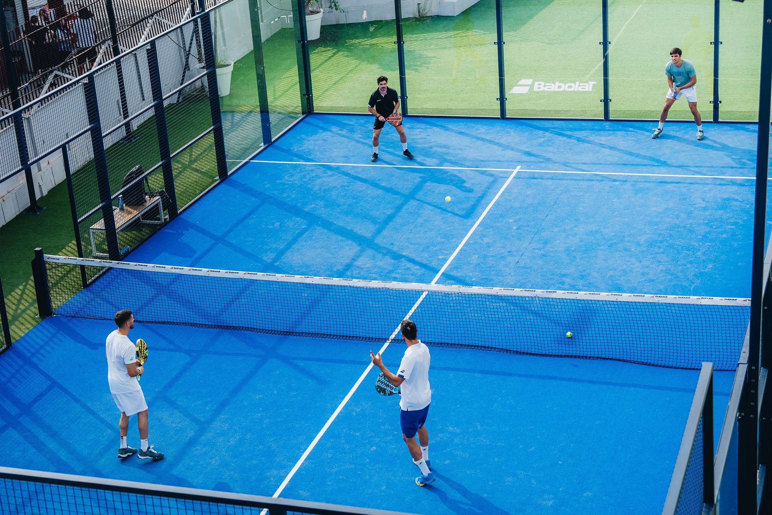 A man on a tennis court holding a tennis racket