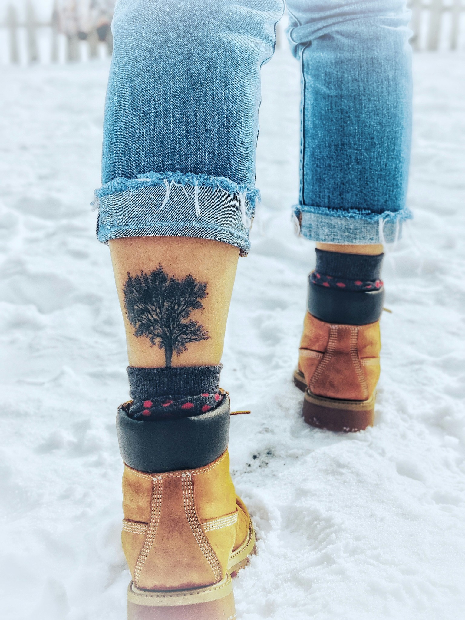 The glow of the moon over an icy lake with mountains in the background