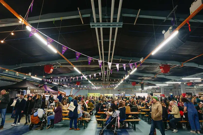 Scene filled with people eating food at event