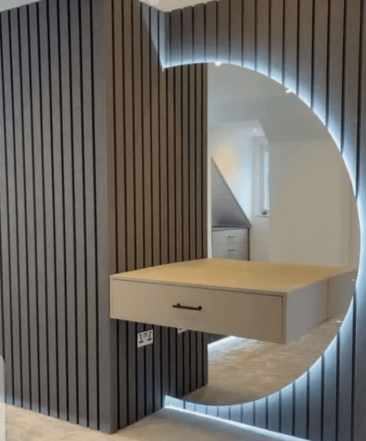 a wooden table with a computer on top of it