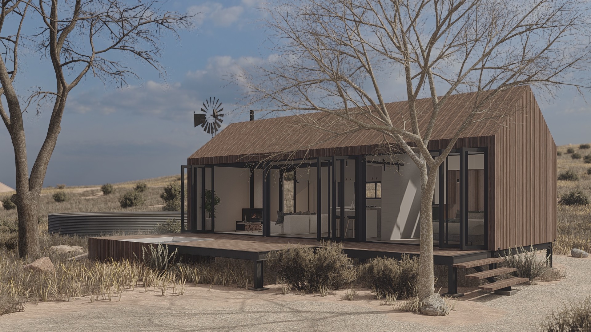 3D render of the Strawtown Stack One off-grid modular home in a dry South African landscape, featuring timber cladding, floor-to-ceiling glass doors, a wooden deck, and a windmill in the background
