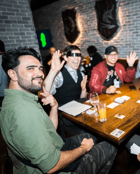 friends playing card games in the tavern