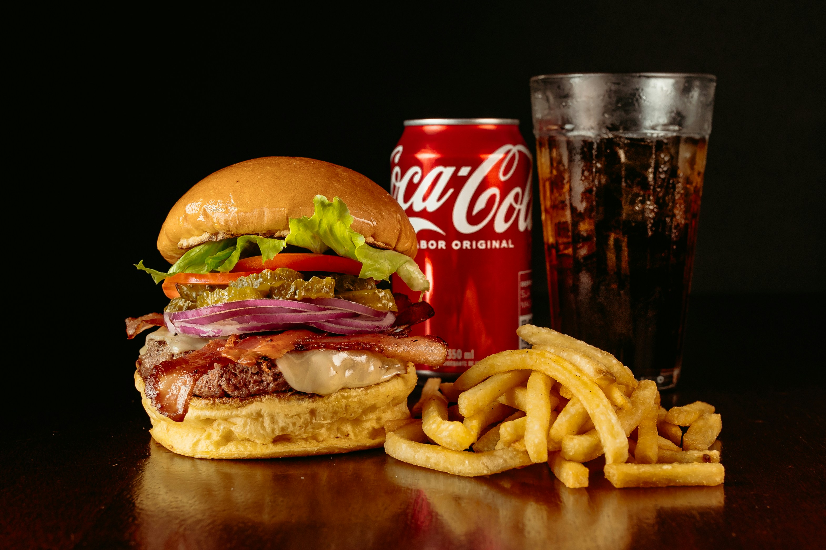 a hamburger and french fries are on a table