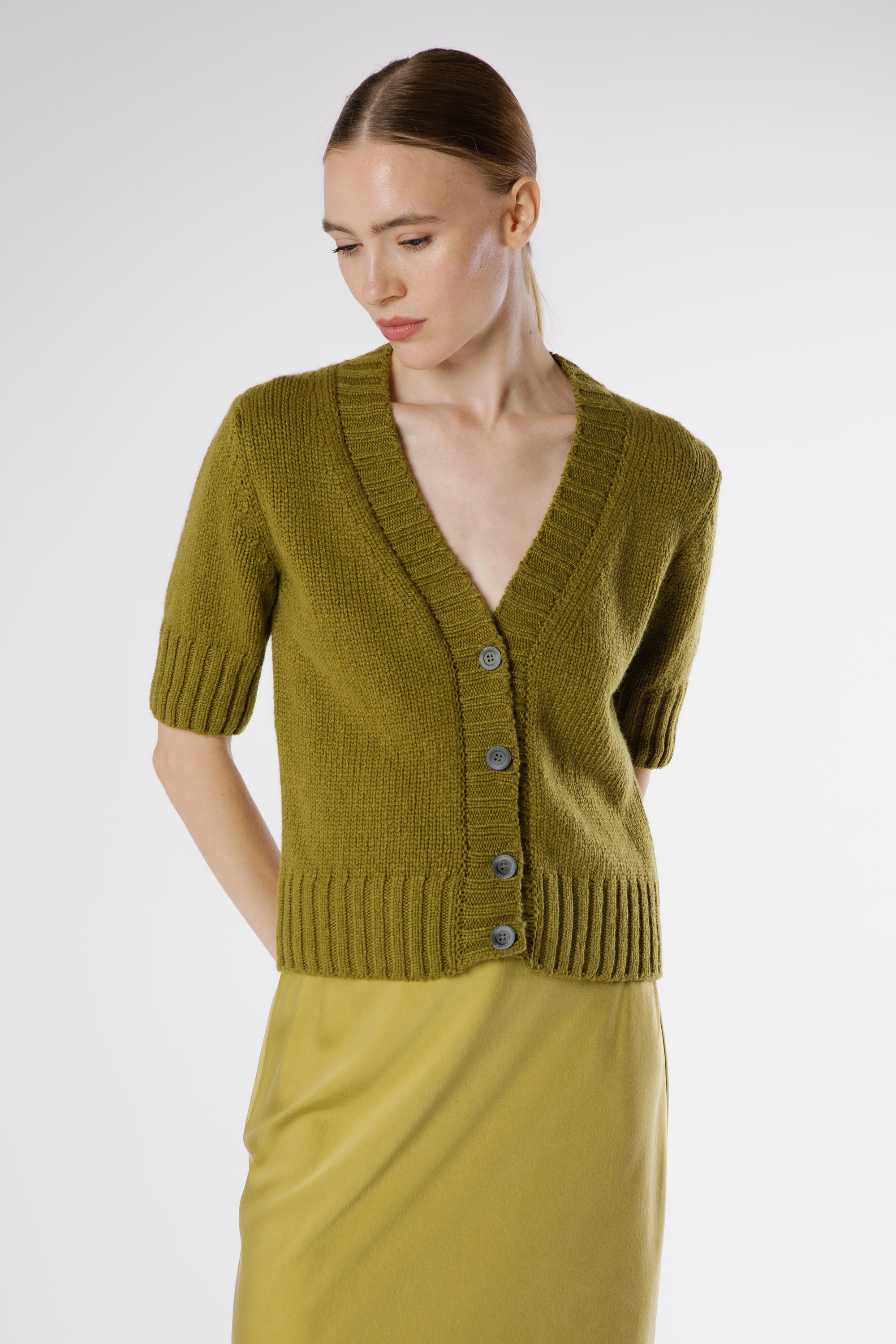 Front view of Artemisa Cashmere Cardigan Juniper in rich green Italian cashmere with V-neckline and ribbed detailing.