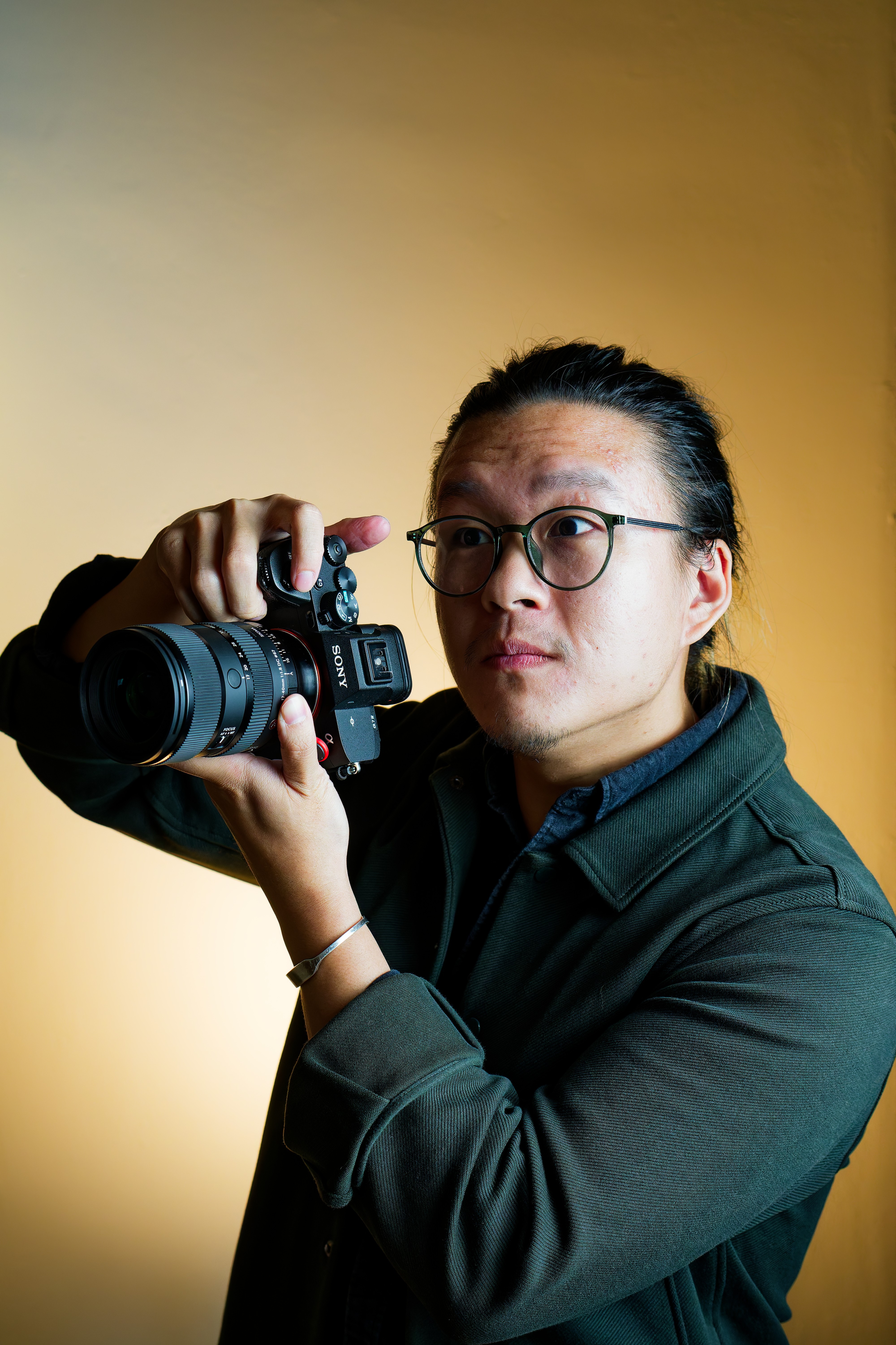 a man reaching down to the camera