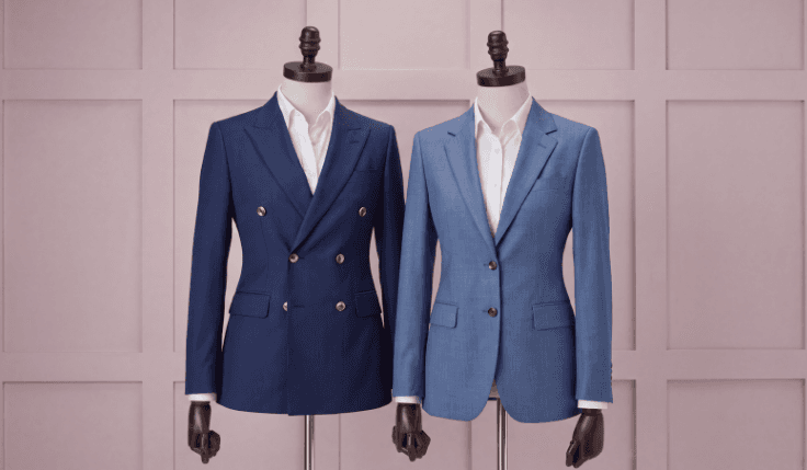 Ink blue and mid-blue bespoke wedding suits displayed on mannequins