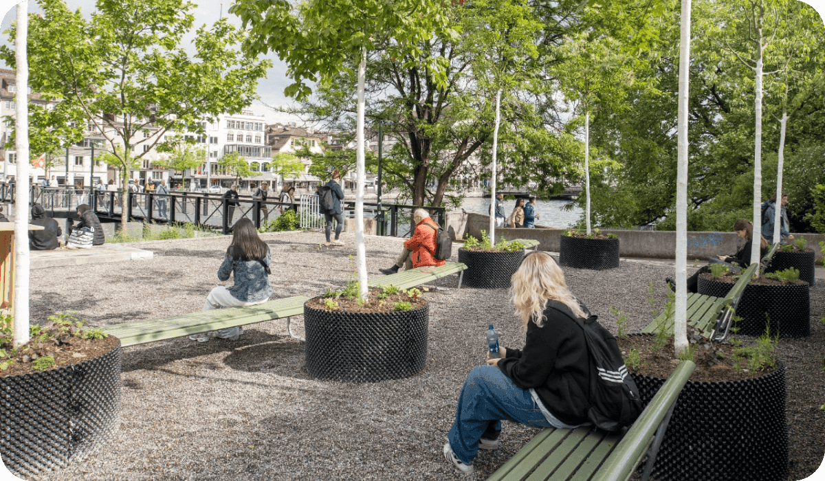 A photo with benches, people, and trees