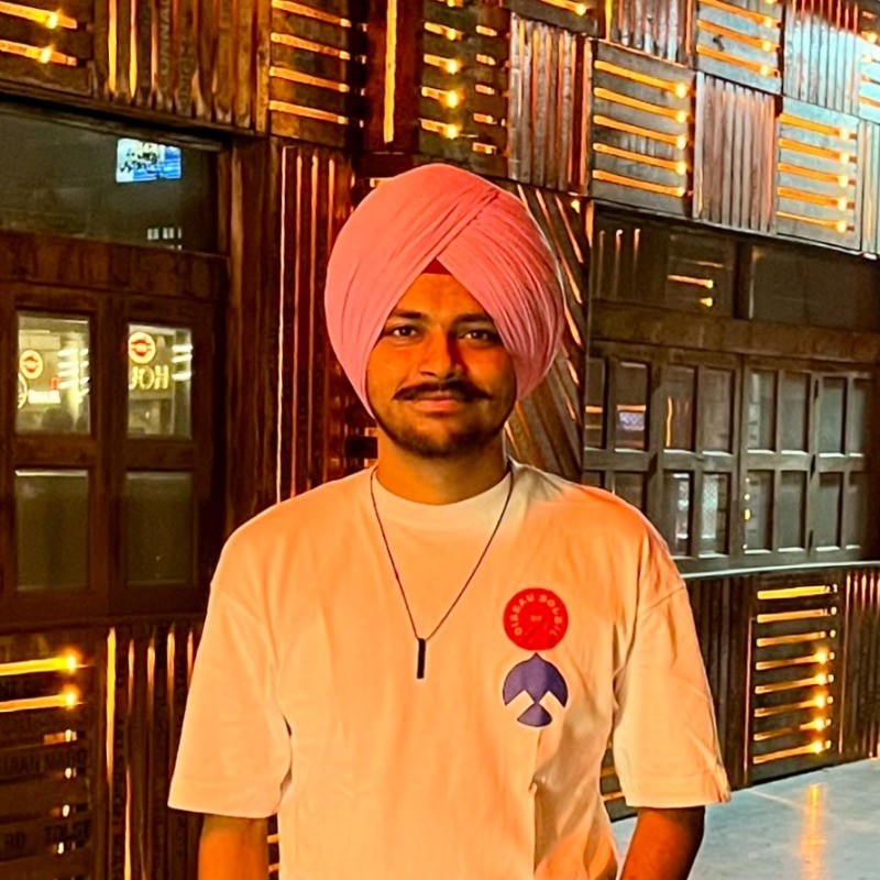 grayscale photo of woman wearing necklace and top