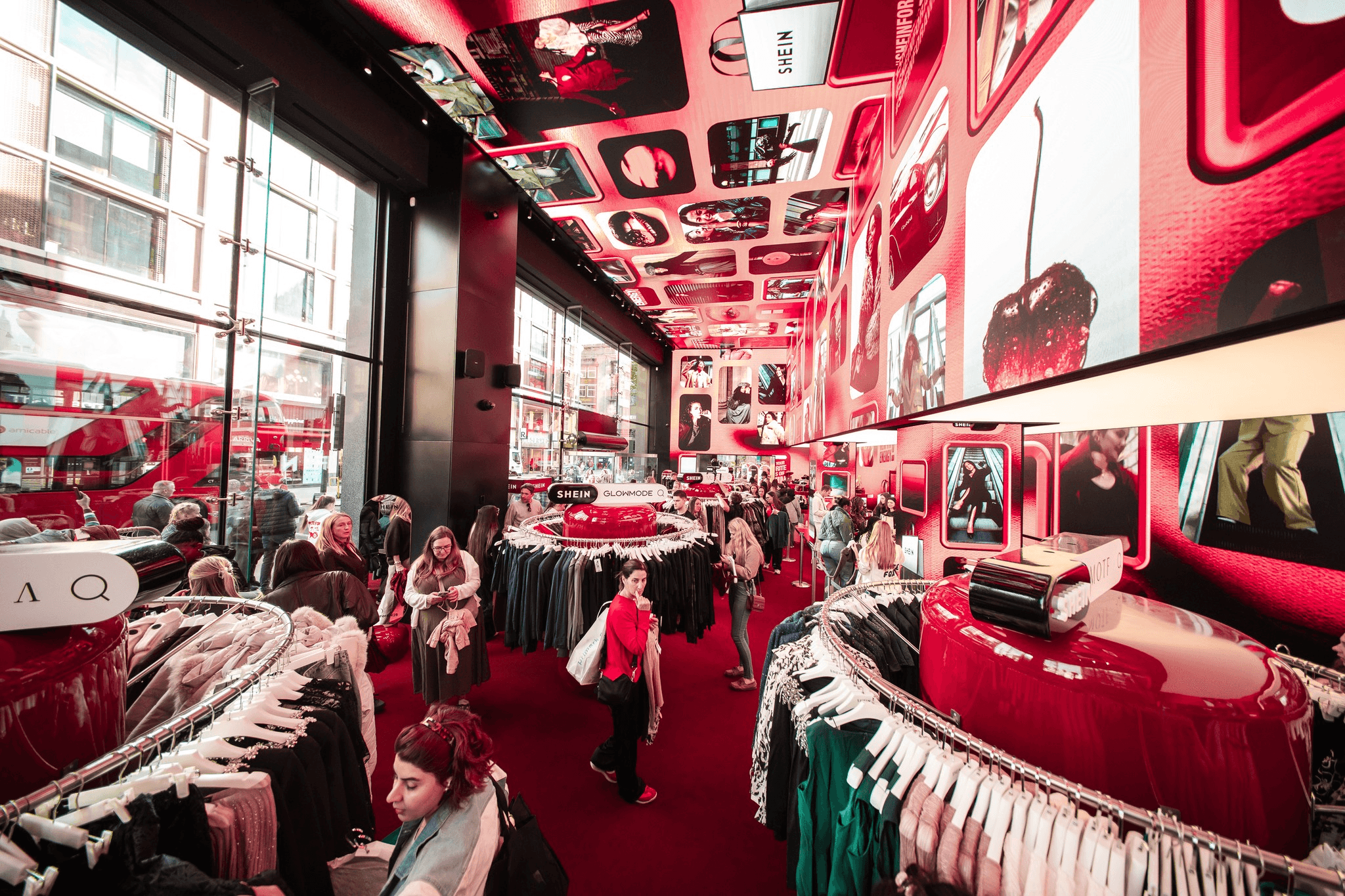 A BBC news studio setup featuring a central desk, bright lighting, and large screens in the background.