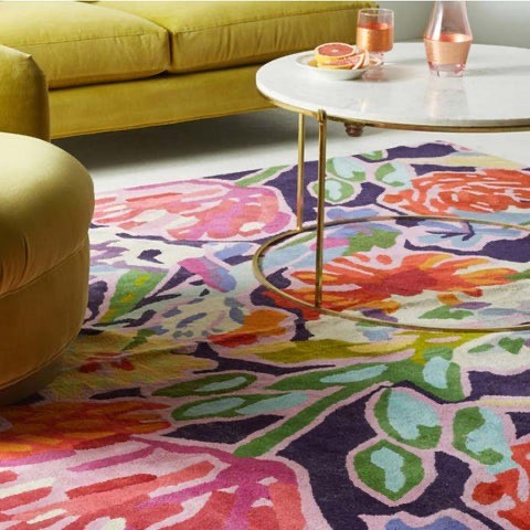 living room with bold pattern rug