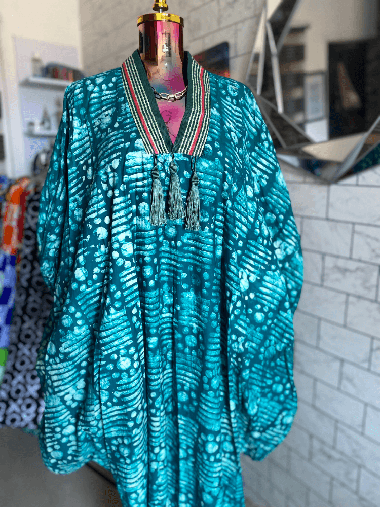 a laptop computer sitting on top of a white chair