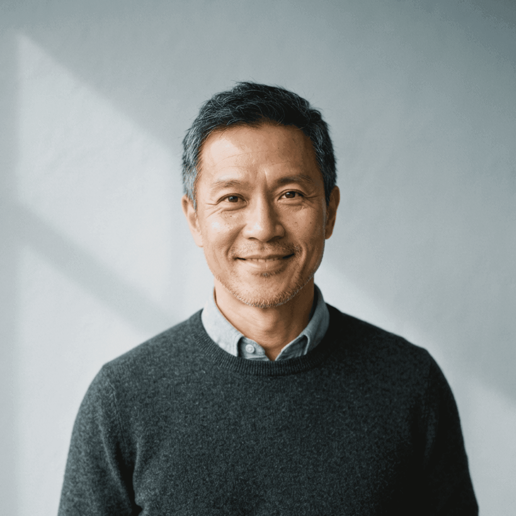 Ray Ng, co-founder, portrait in a dark knit sweater