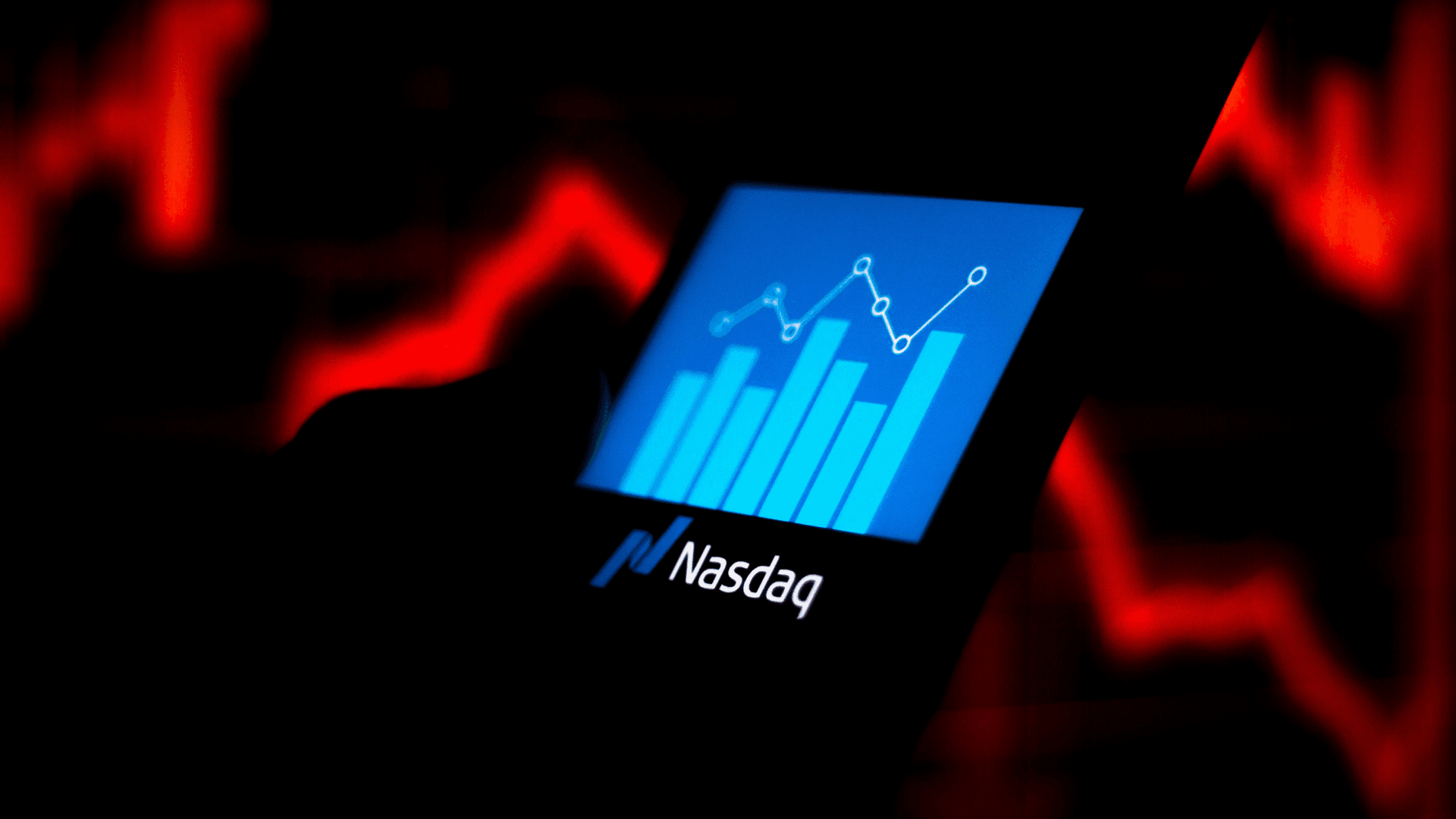 In this photo illustration the Nasdaq Composite logo seen displayed on a smartphone