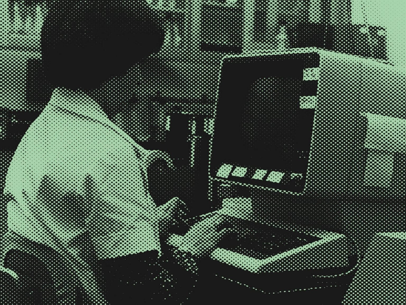 Vintage image of a person working on an early computer, symbolizing the foundations of quantum and advanced technology.
