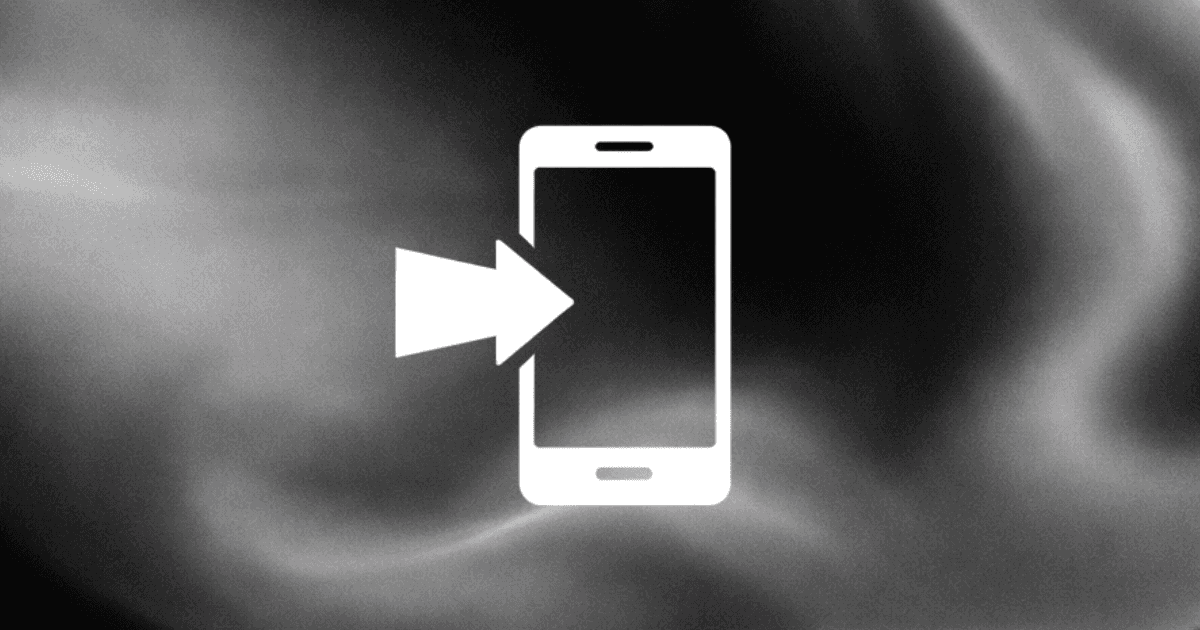 person using macbook air on white table