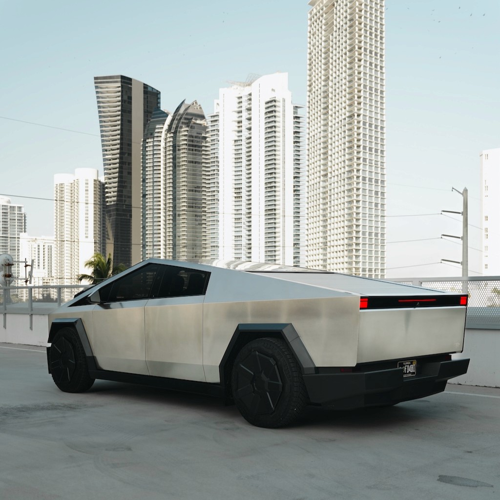 Rear three-quarter view of the Tesla Cybertruck Cyberbeast showing off its bold lines and wide stance.