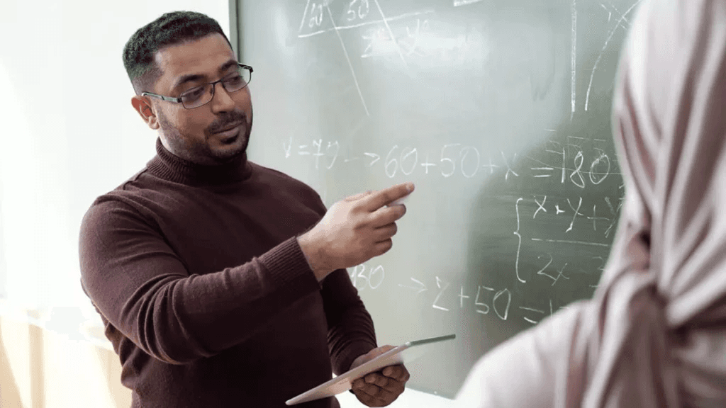high school student working on original mathematics research paper at a desk with notebooks
