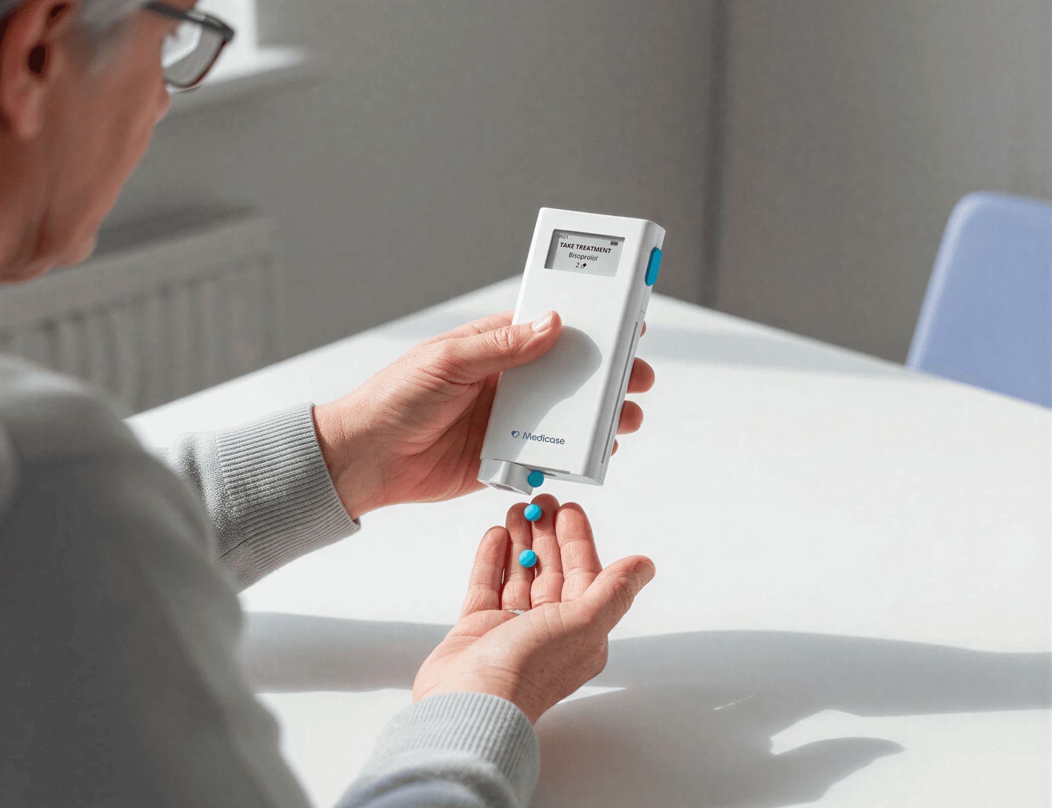 Patient pressing the single button on Medicase to receive exact medication dose