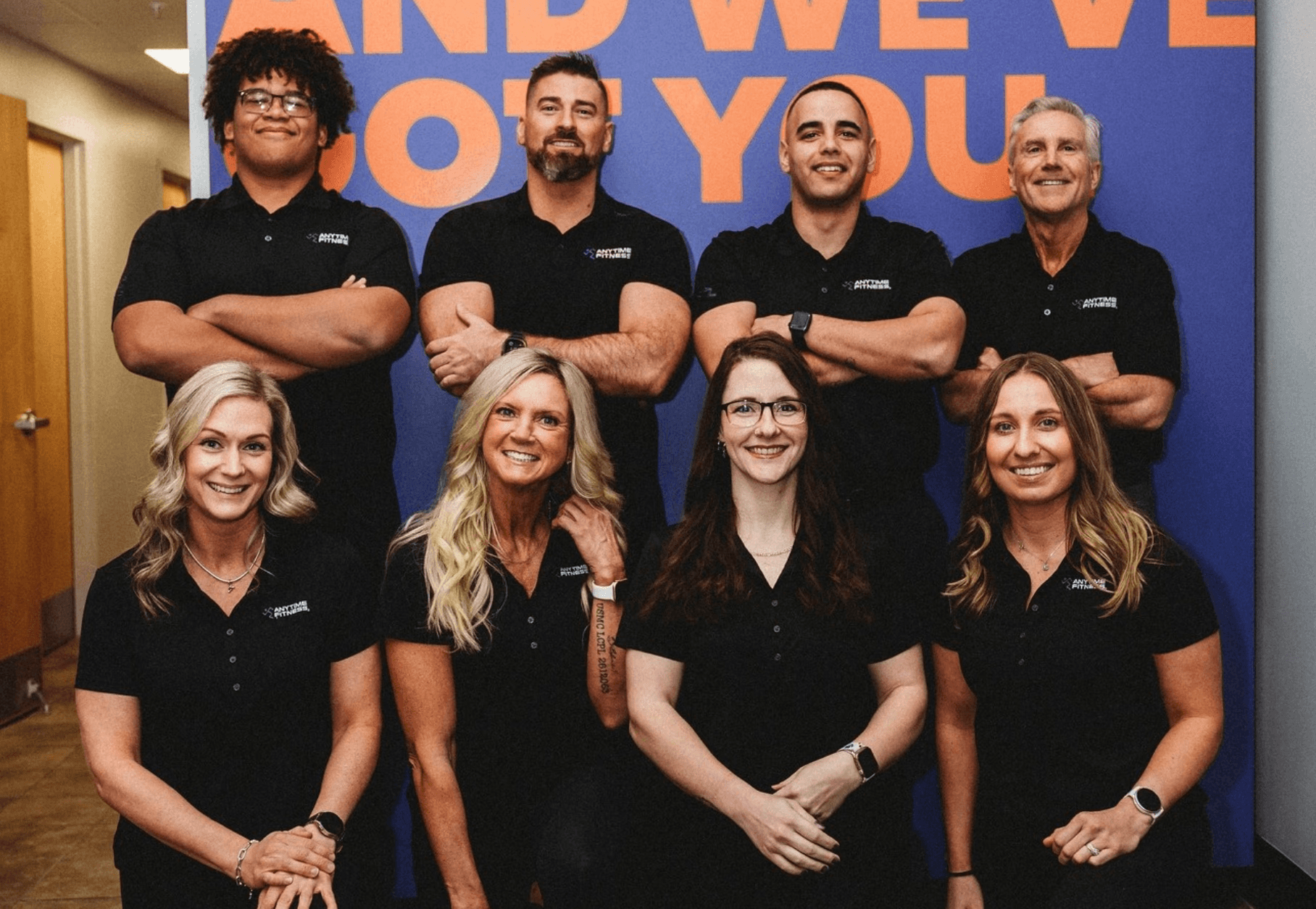 man sitting while having coffee and using laptop