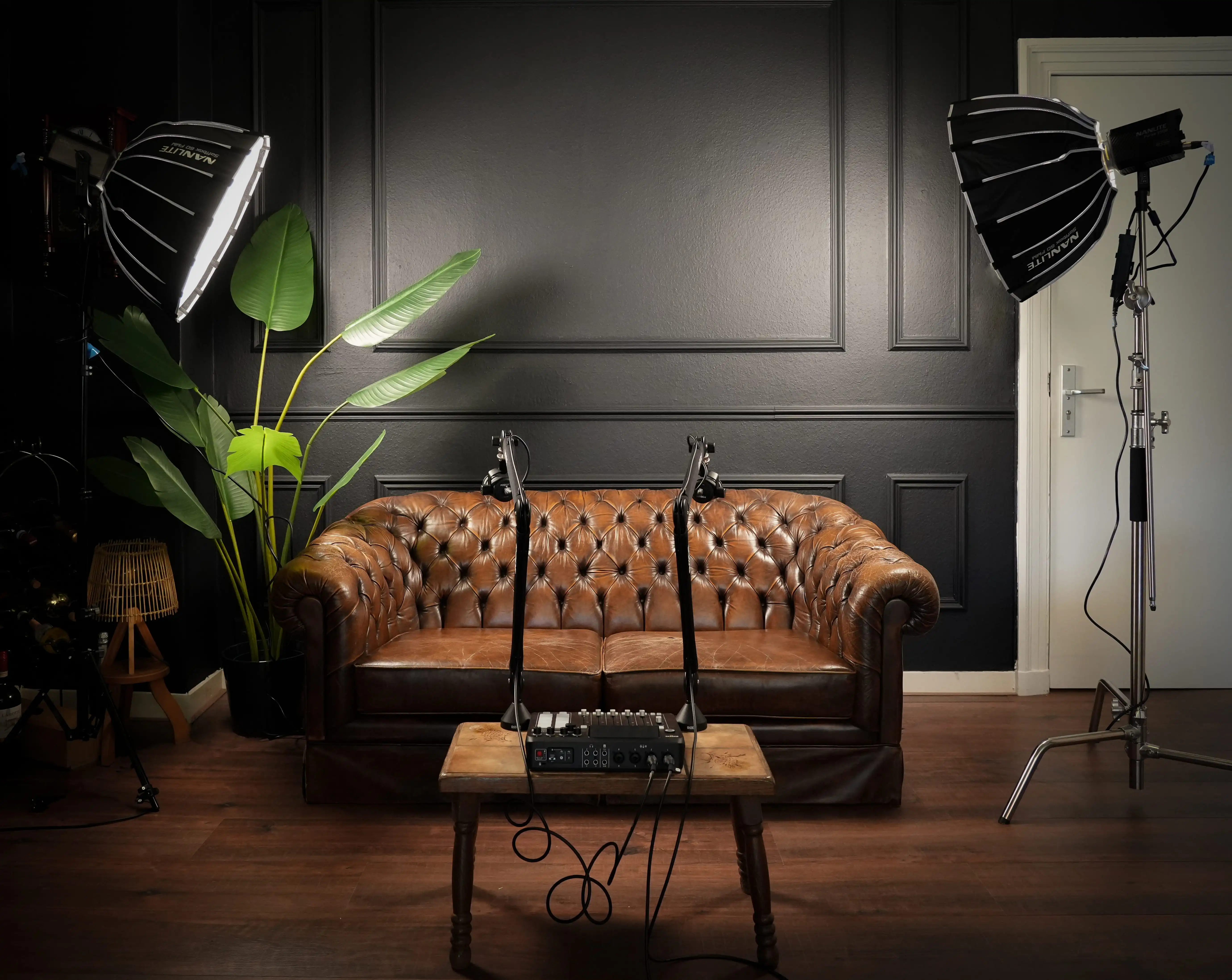 man in white crew neck t-shirt sitting on black chair