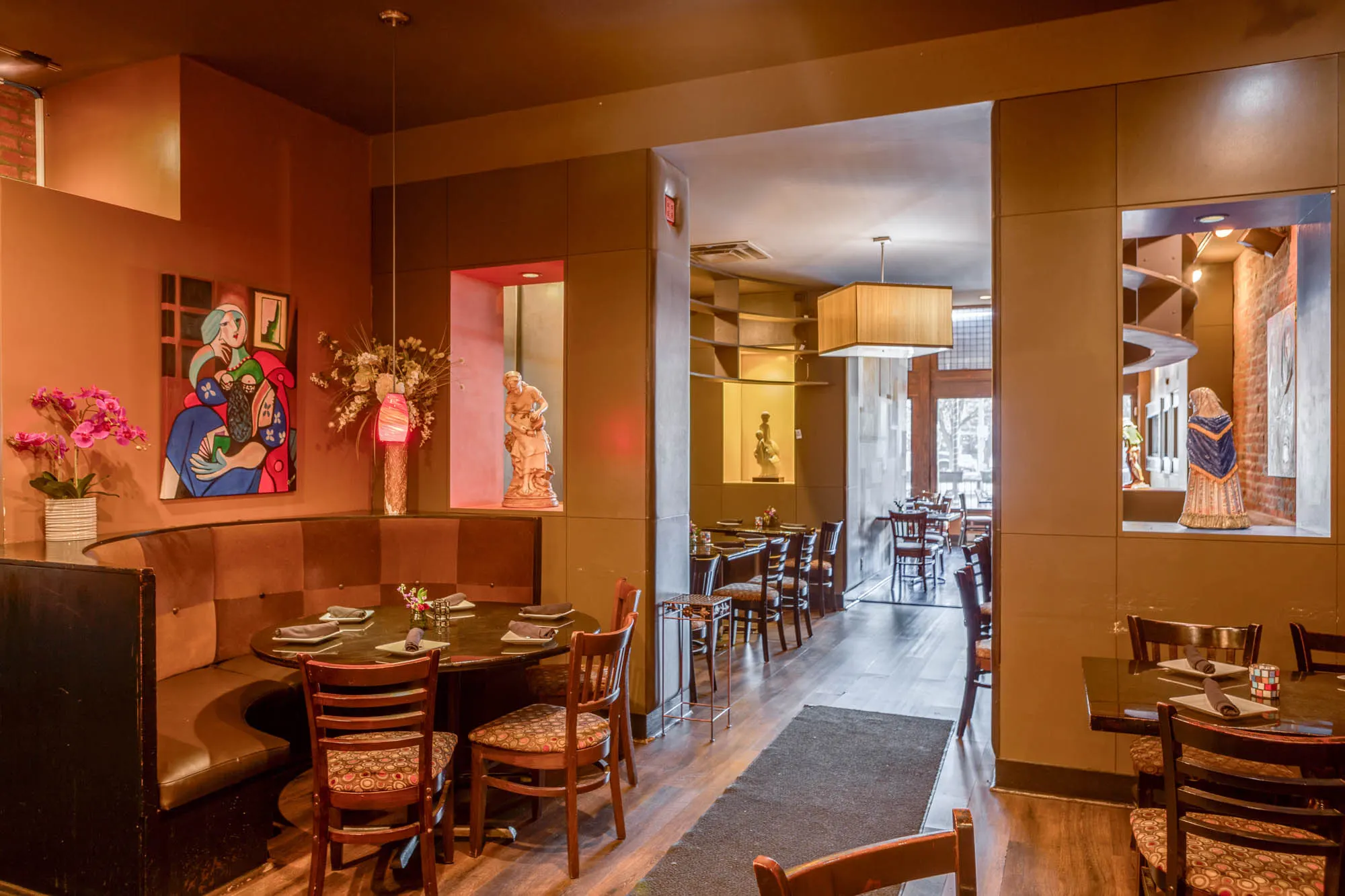 Round banquette seating and tables in the Sidebar dining room