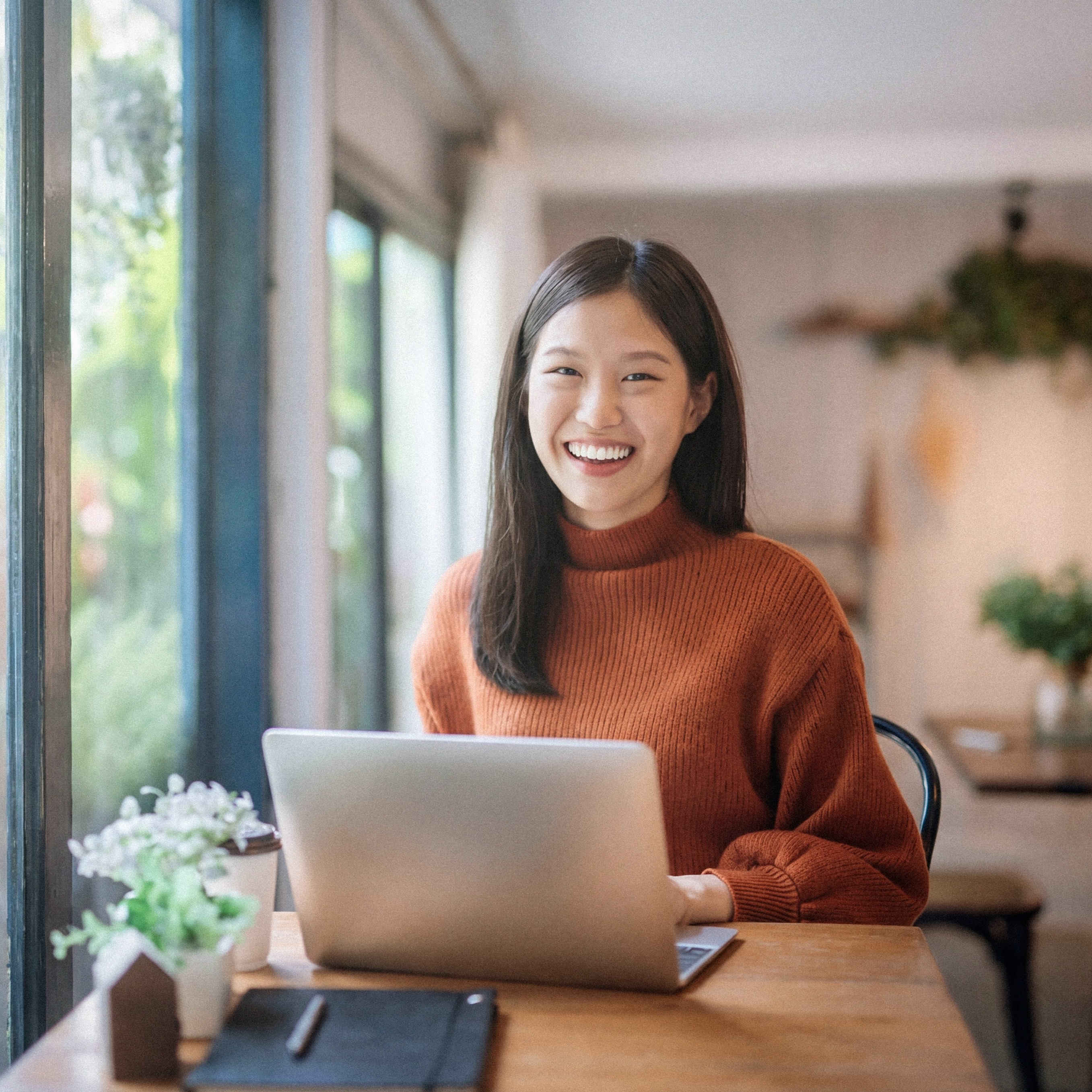 An instructor smiling warmly while conversing with a student at 612 Academy, reflecting empathy and connection.