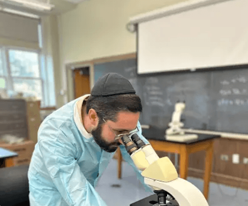 man holding his graduation cap