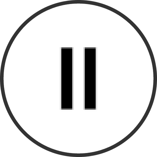 A cozy room with a wooden desk, computer, and warm sunlight streaming through a window.