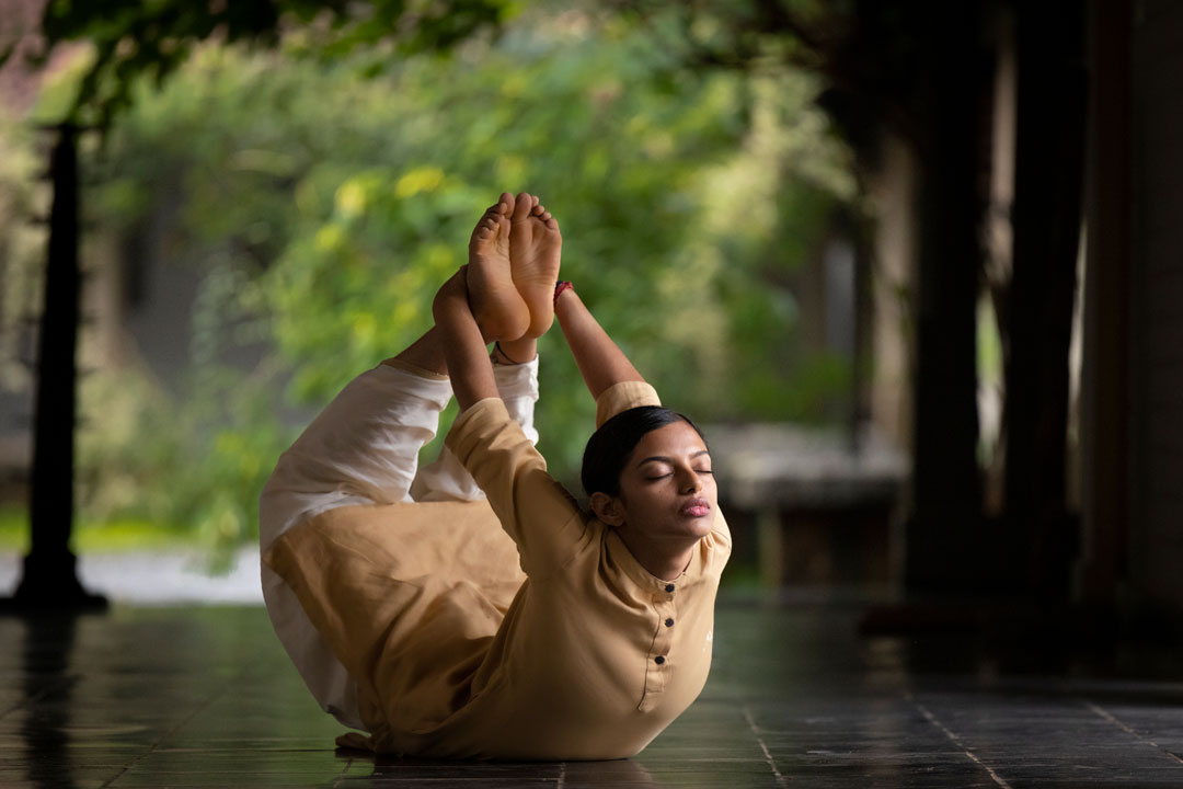 Bride in white dress walking on street, blurred motorcycle passing