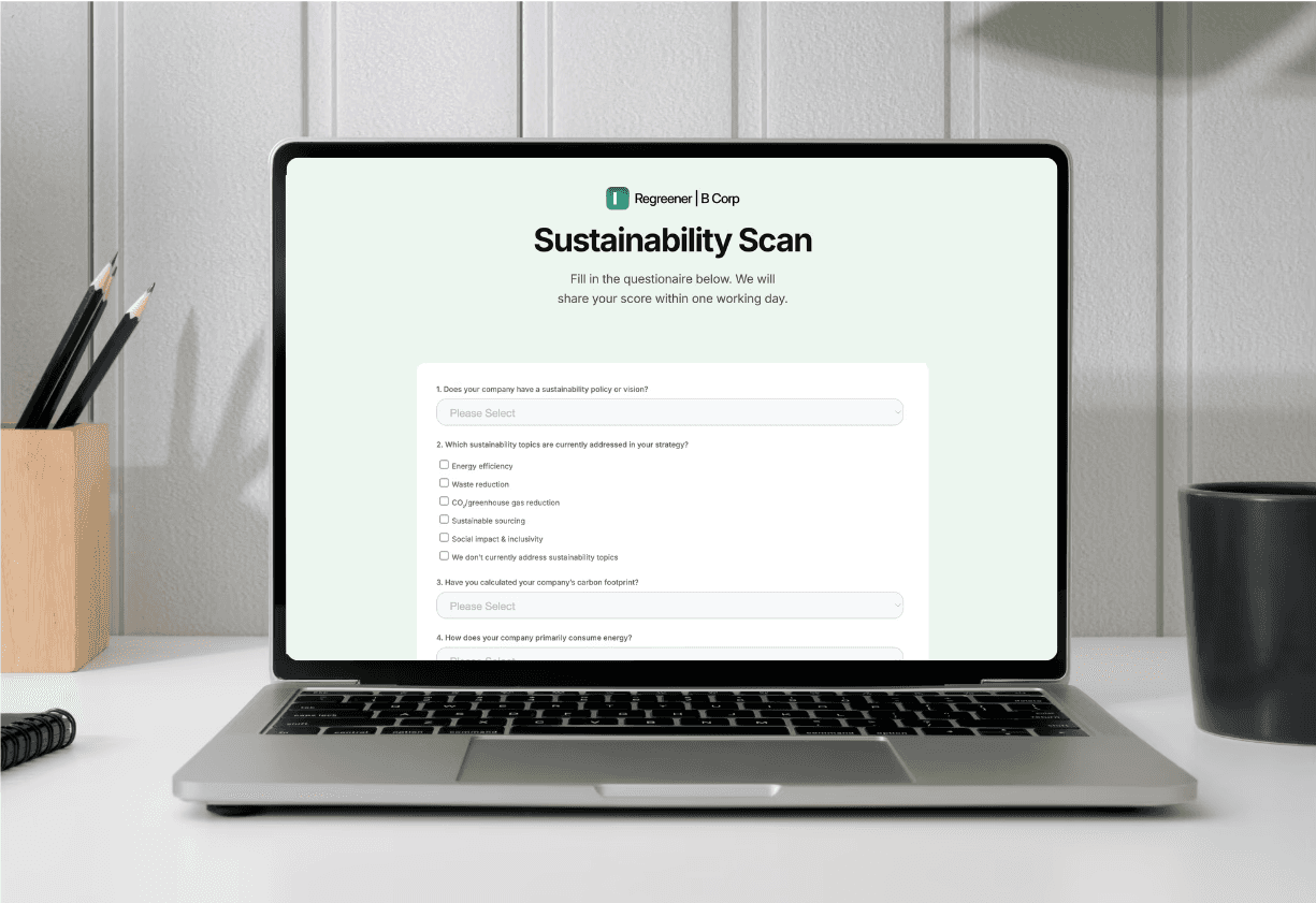 laptop on a desk with a sustainability scan for companies