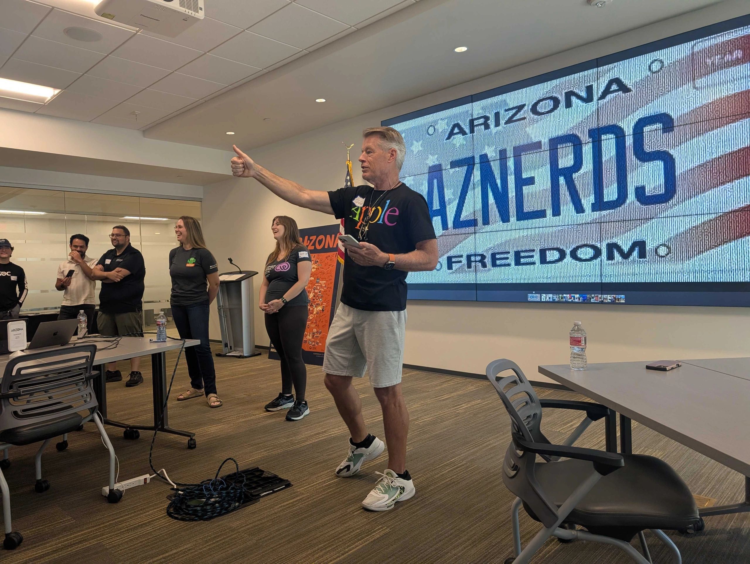 a black and white living room with a large tv
