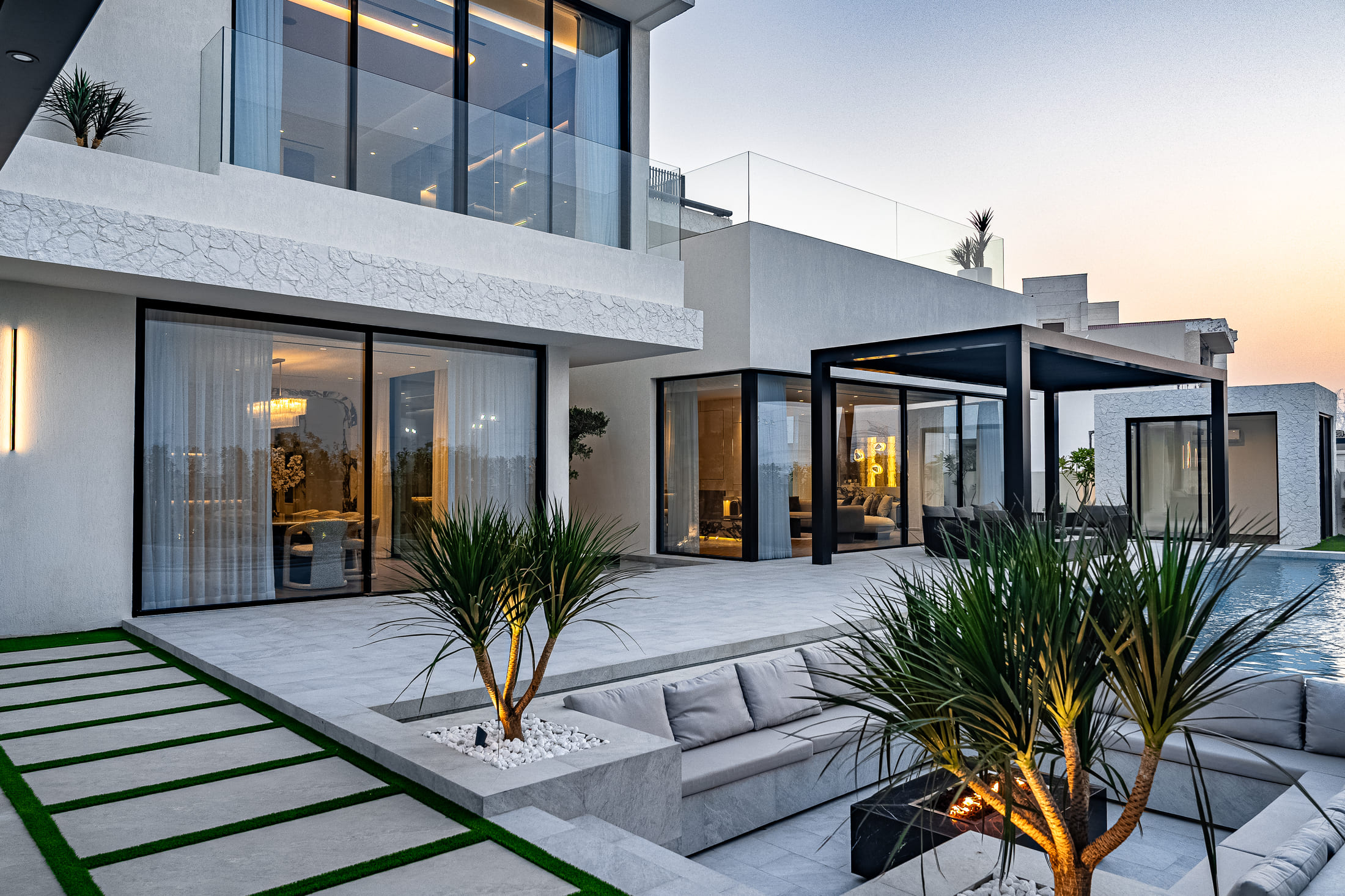 Image of a large villa with big glass windows