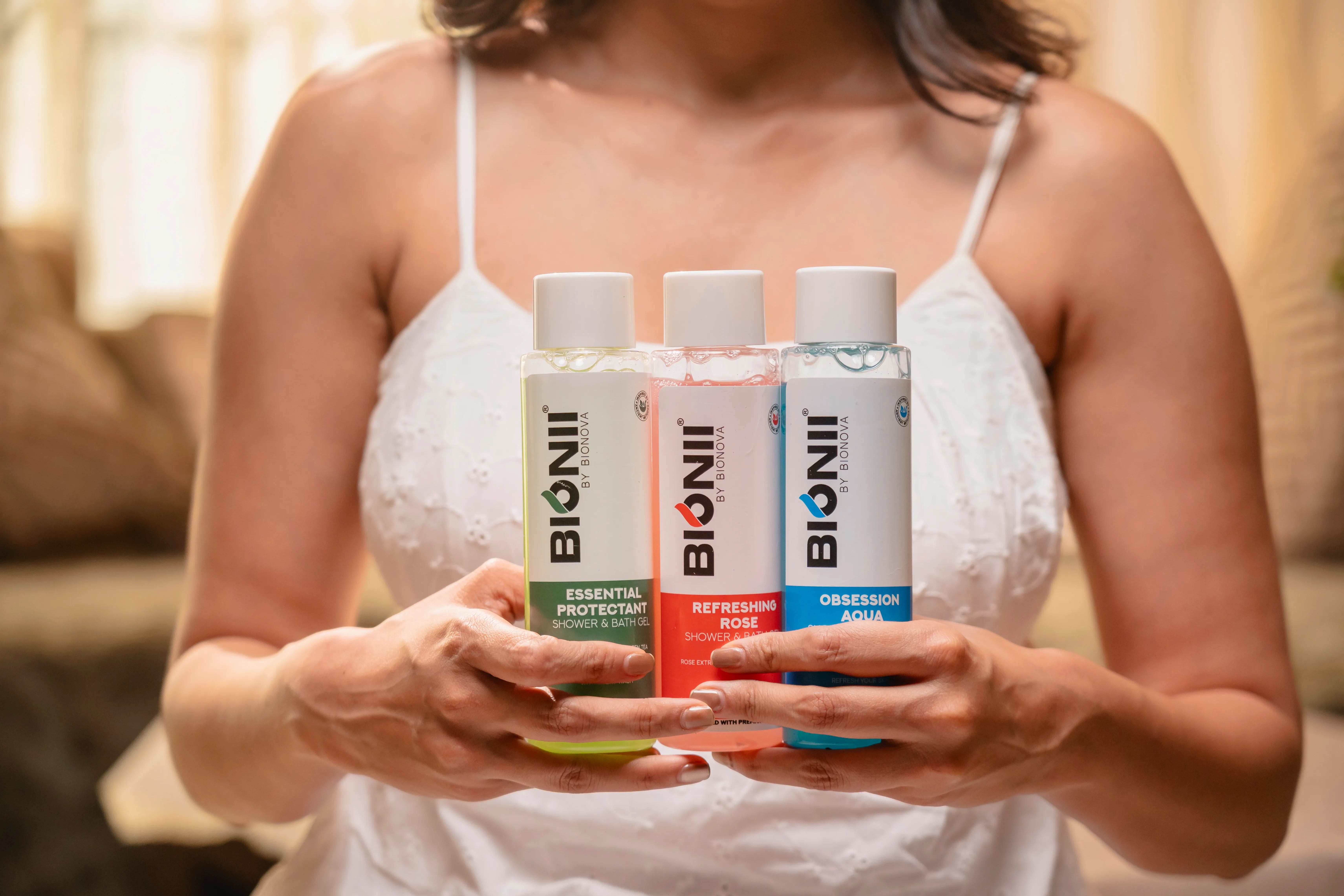 Woman showcasing Bionii skincare product during daily routine