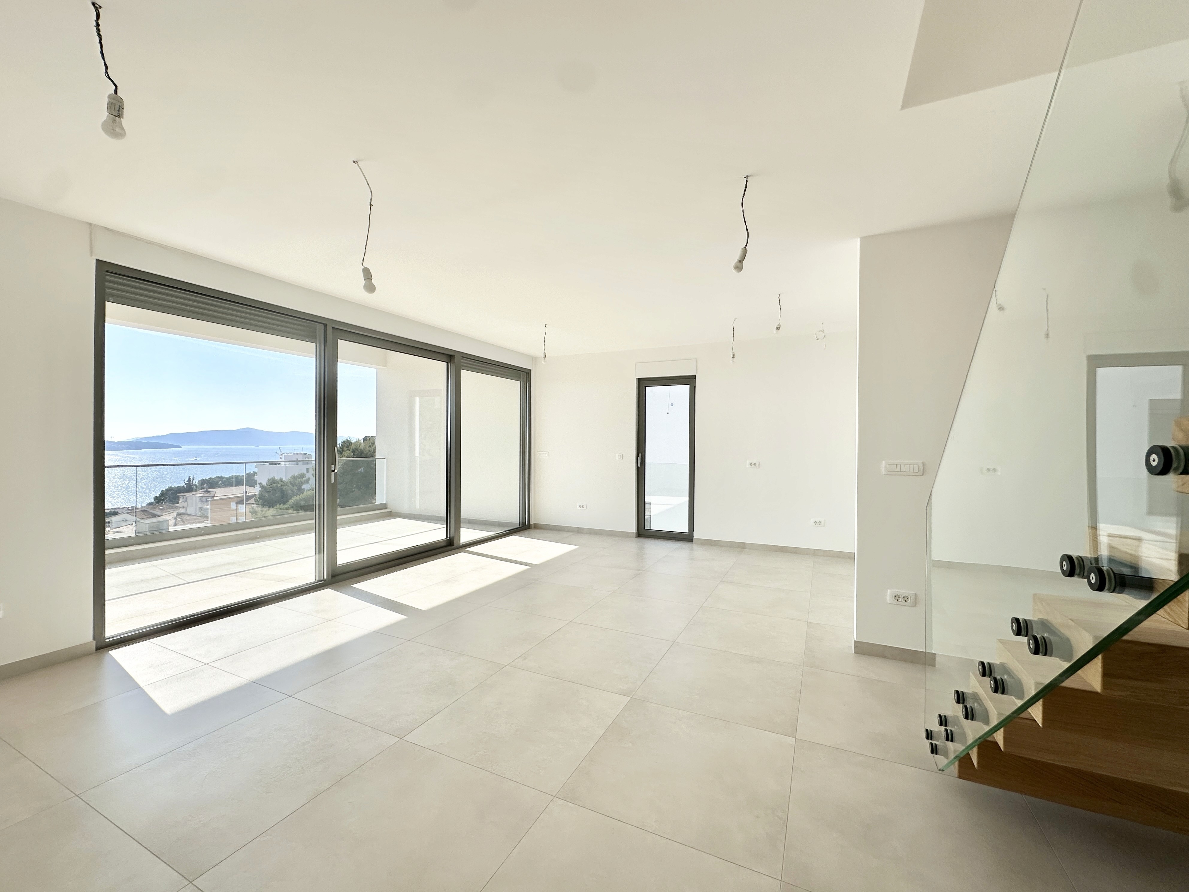 Large modern interior space with concrete walls