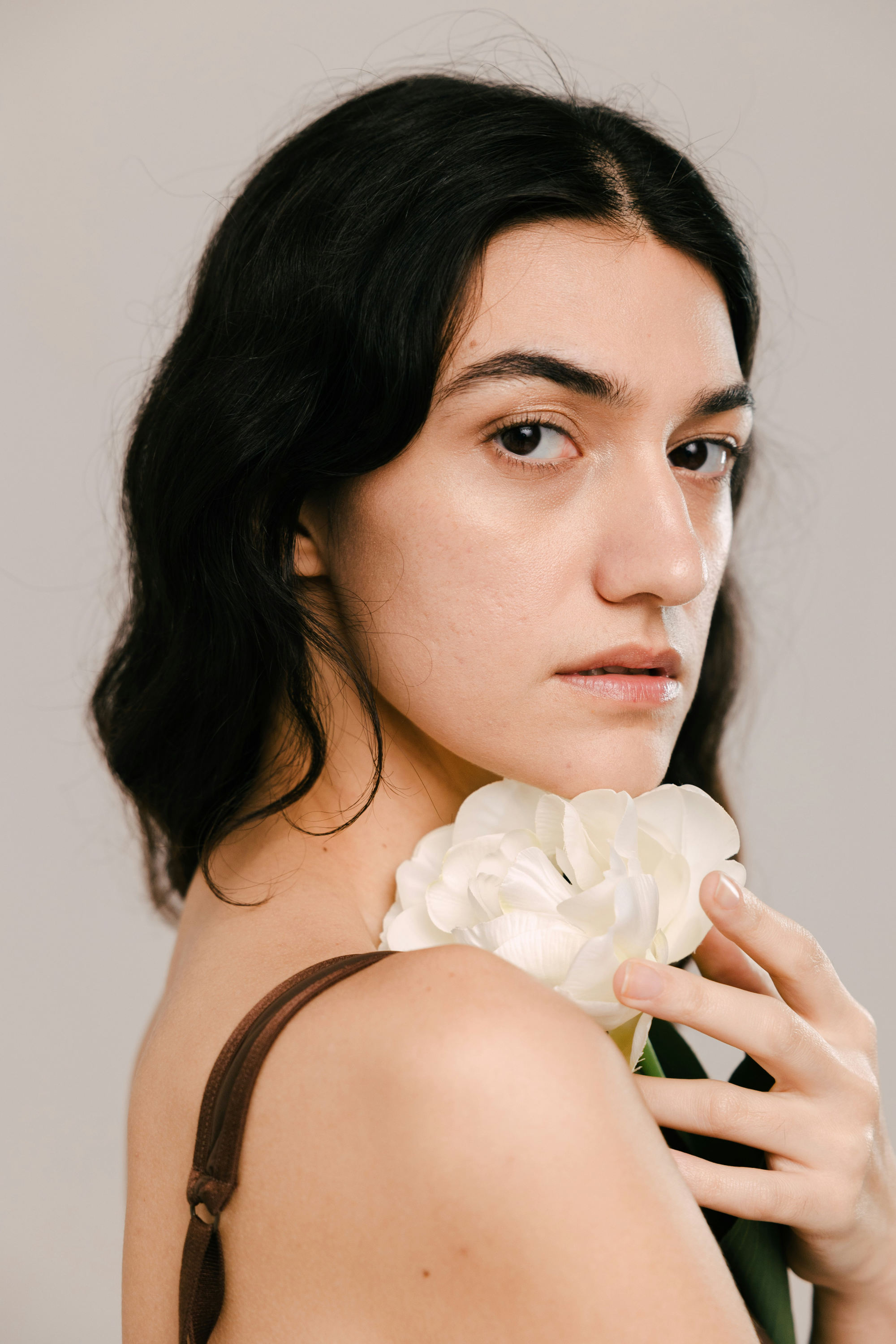 A woman holding a flower