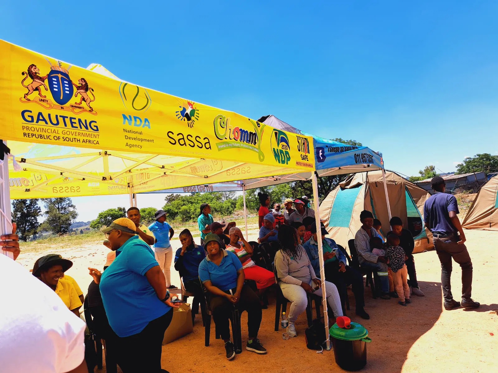 A hand holding a black pen, poised to write or draw on a surface.