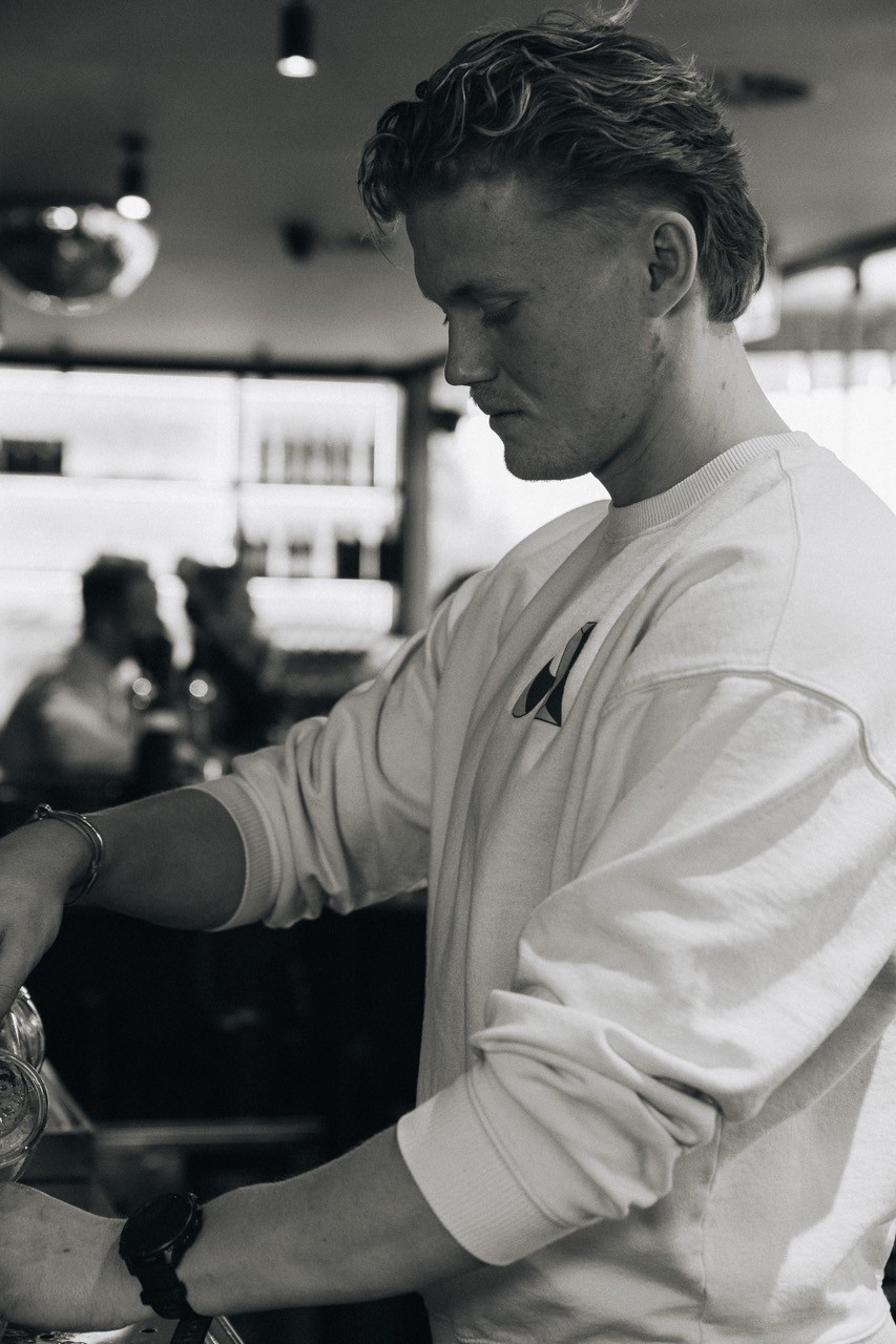 staff pouring in drink at restaurant