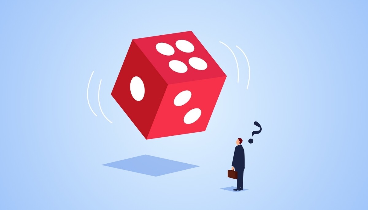 Illustration of a businessperson looking up at a spinning red die with a question mark overhead.