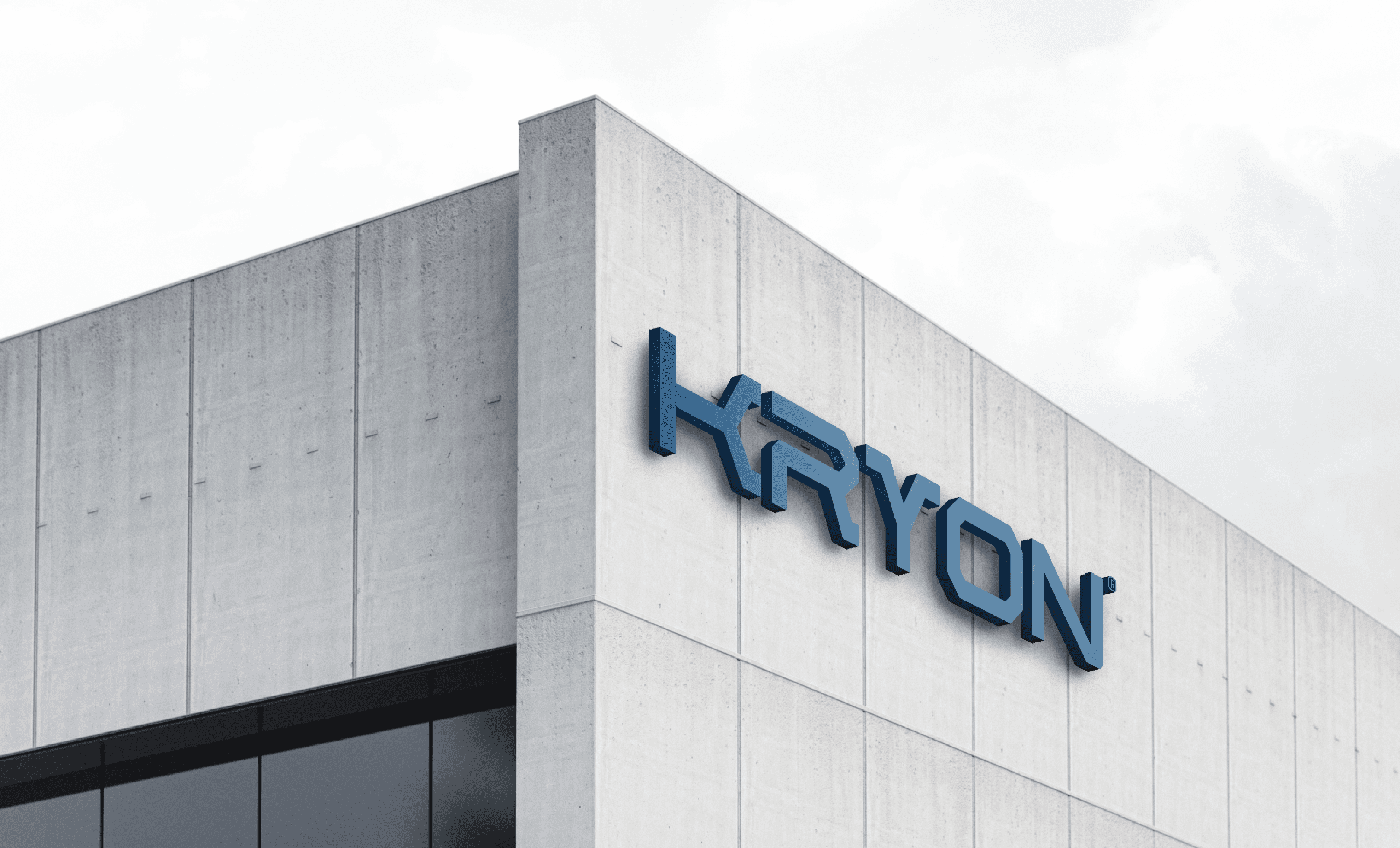 Uma fachada industrial da empresa com o logotipo da marca Kryon