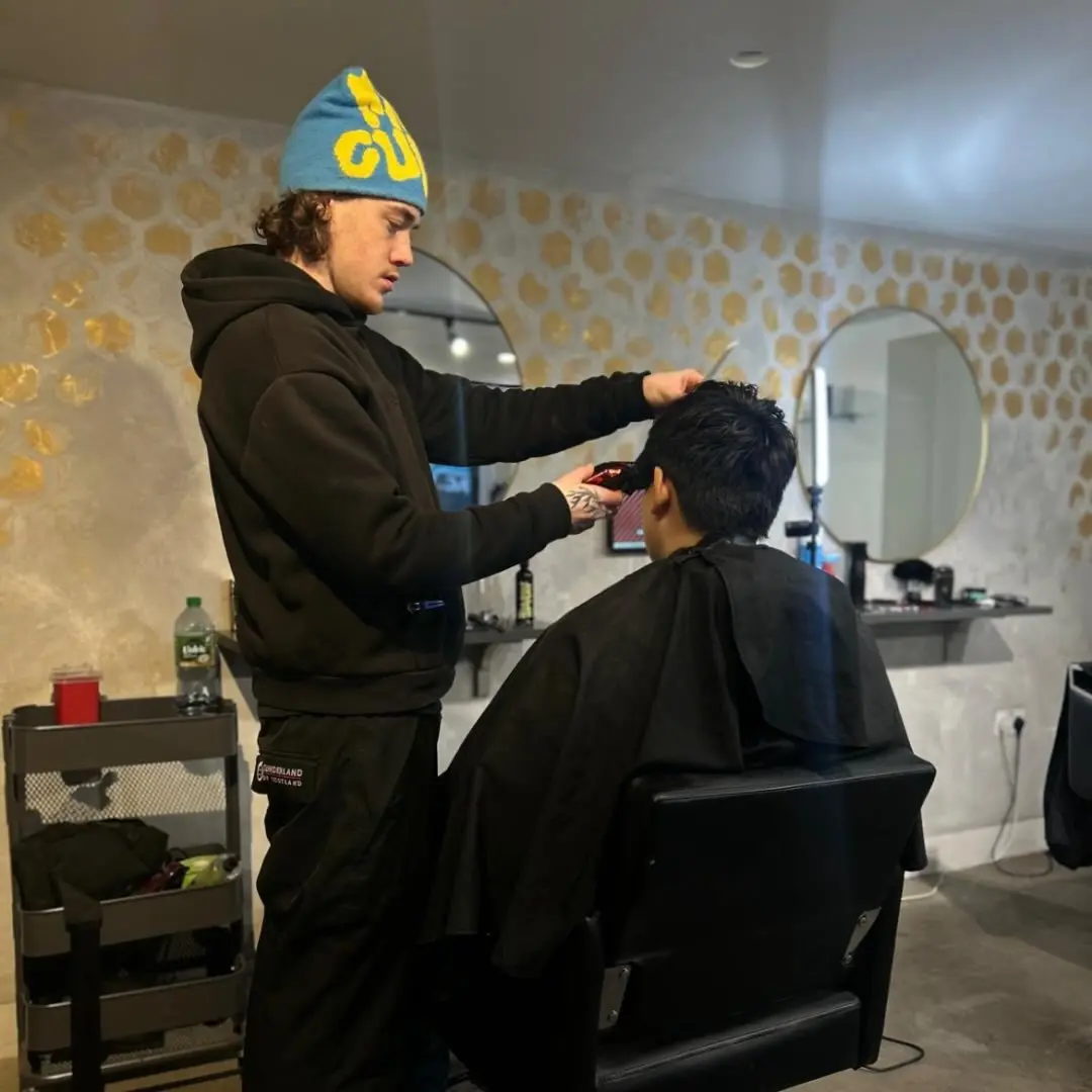 Image of Seb cutting hair